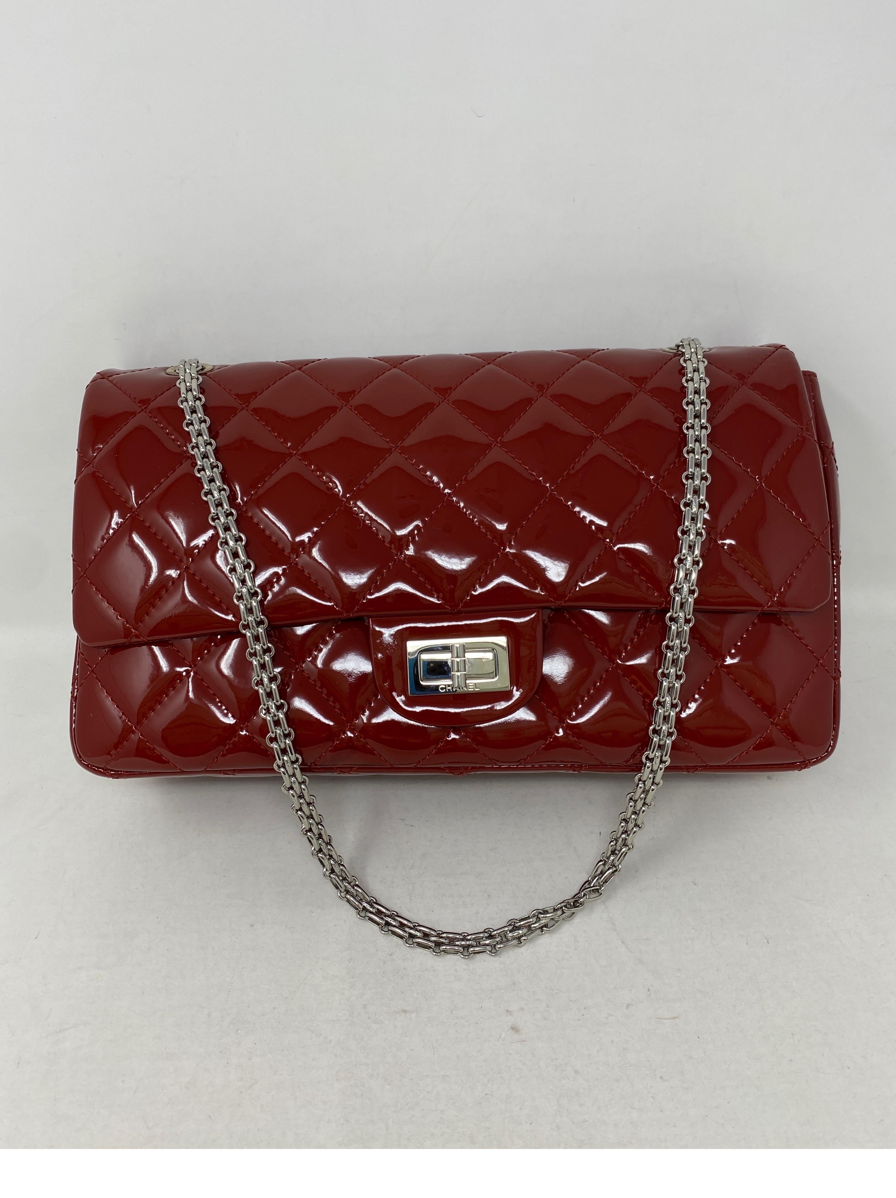 Chanel Reissue Jumbo Red Patent Leather Bag. Silver Chain. Can be worn crossbody or doubled as a shoulder bag. Excellent like new condition. Guaranteed authentic. 