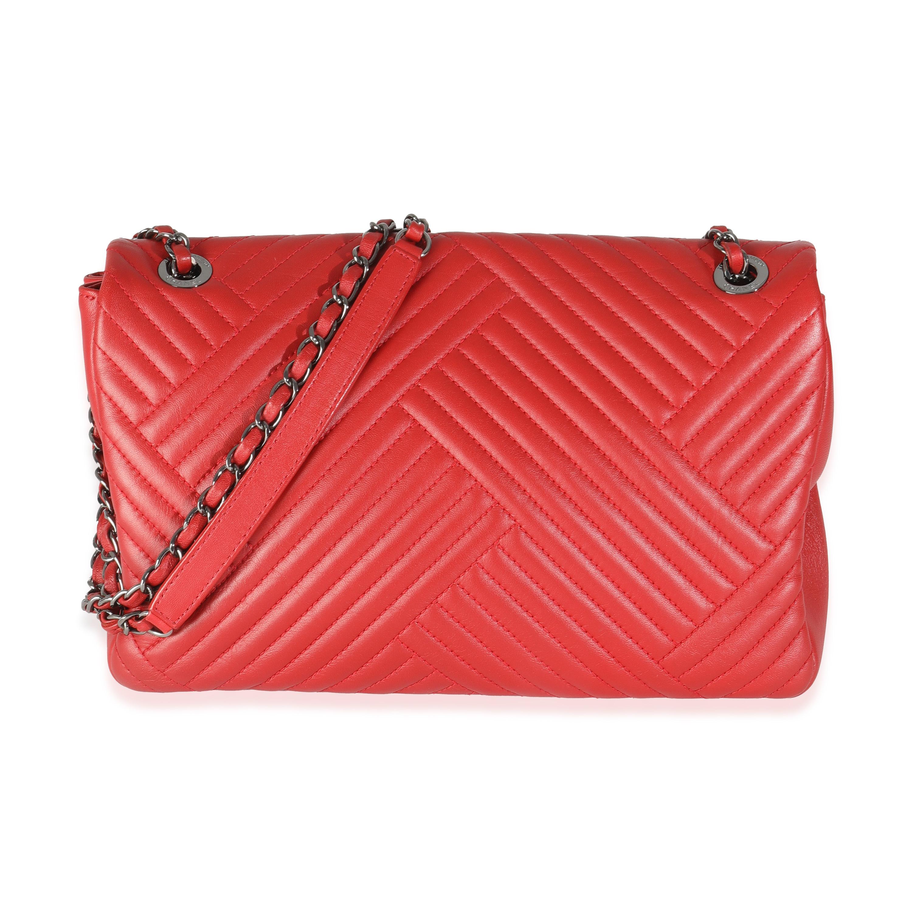 Listing Title: Chanel Red Lambskin CC Medium Crossing Flap Bag
SKU: 144729
Condition: Pre-owned 
Condition Description: A timeless classic that never goes out of style, the flap bag from Chanel dates back to 1955 and has seen a number of updates.