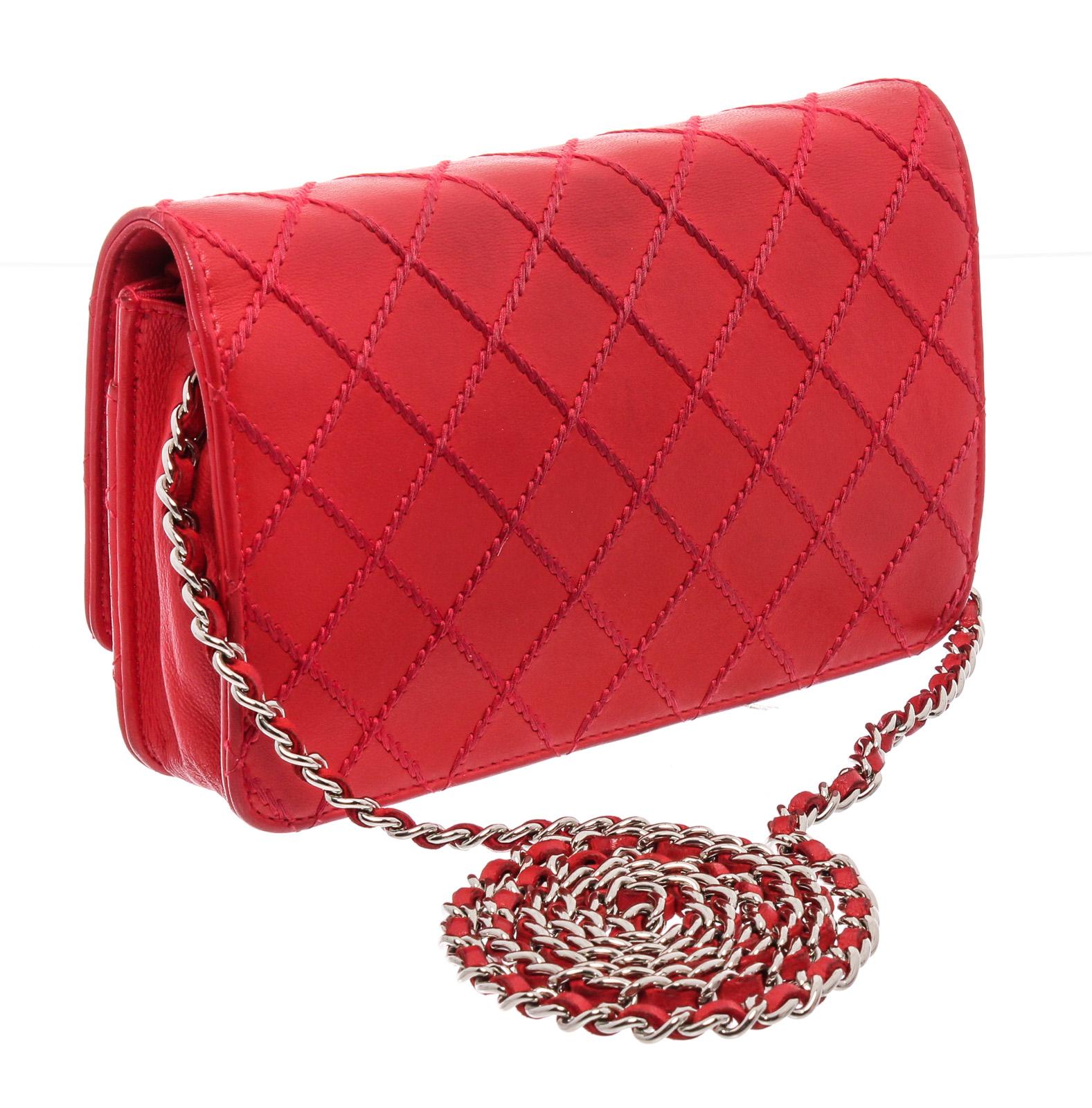 Red Diamond Stitch lambskin Chanel Wallet on Chain with silver-tone hardware, single chain-link and leather shoulder strap, single zip pocket at flap underside, single slit pocket under flap, tonal grosgrain lining, dual interior pockets; one with
