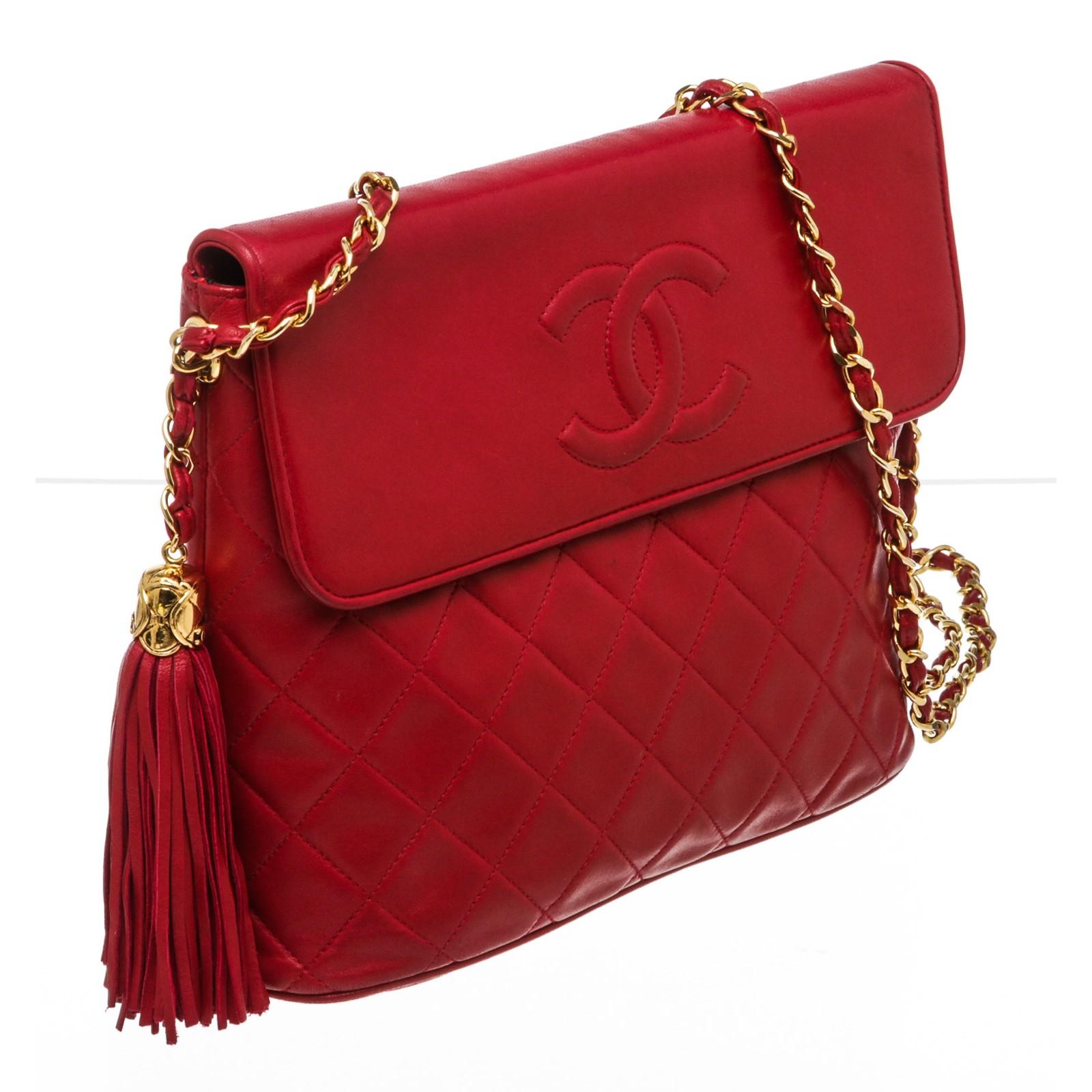 Chanel red quilted Lambskin leather tassel bag with gold-tone hardware, black leather lining, interior zip pocket, and flap with snap closure. 18370MSC.