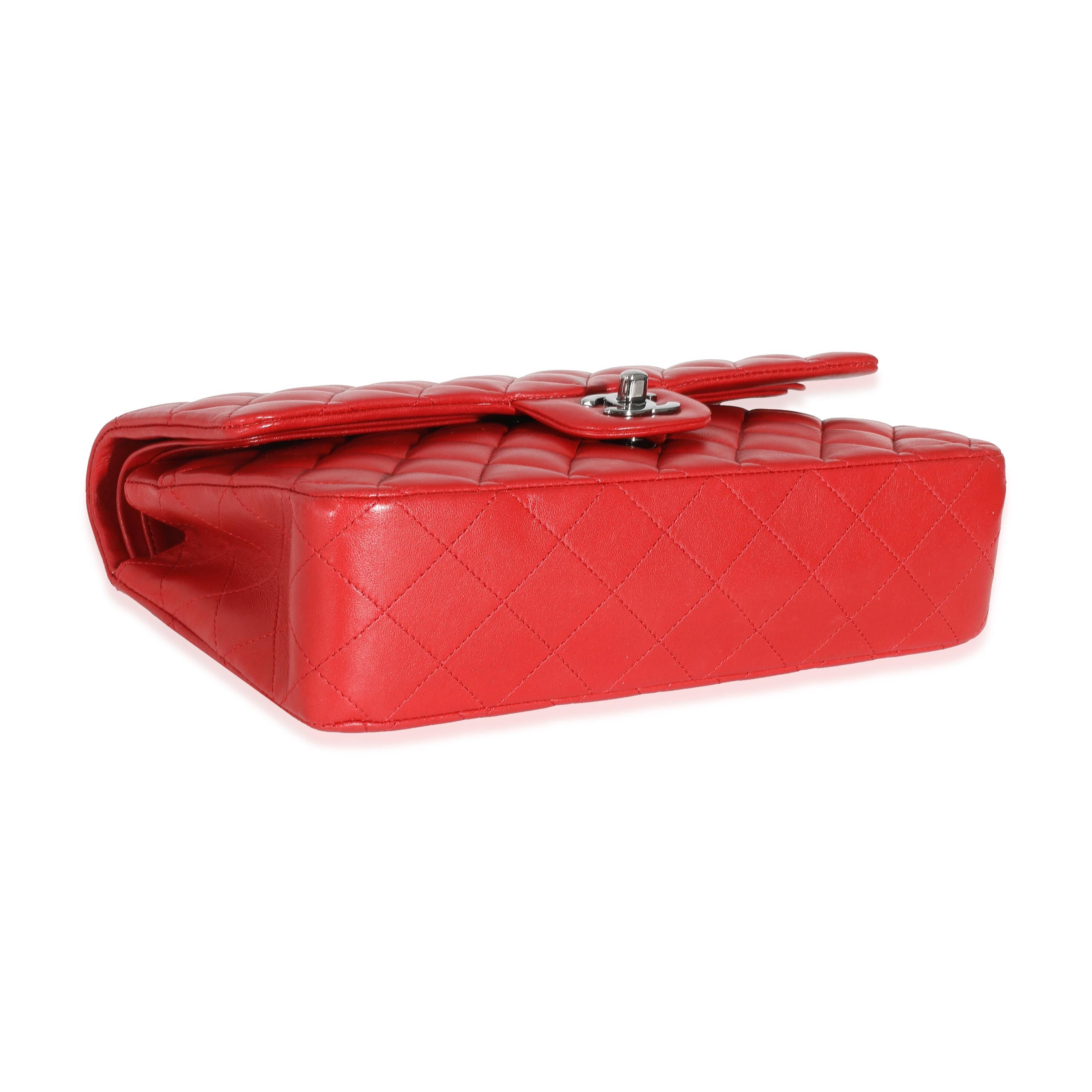 Listing Title: Chanel Red Lambskin Medium Classic Double Flap Bag
SKU: 132025
MSRP: 10200.00
Condition: Pre-owned 
Condition Description: A timeless classic that never goes out of style, the flap bag from Chanel dates back to 1955 and has seen a