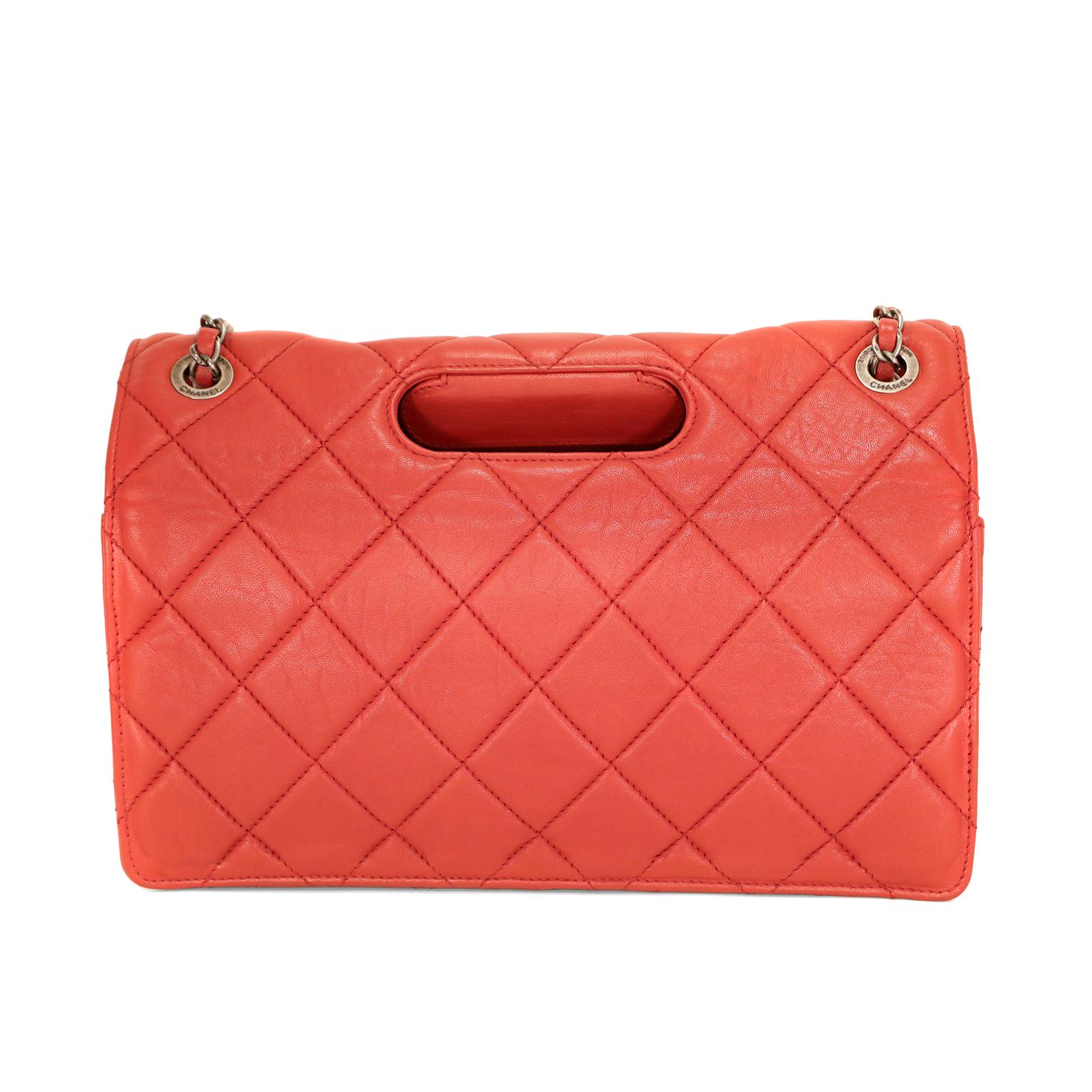 This authentic Chanel Red Lambskin Paris Byzance Takeaway Flap Bag is in great  condition.  From the 2011 collection, the edgy take on a reissue flap bag is unique and beautiful.  
Lipstick red lambskin is quilted in signature Chanel diamond