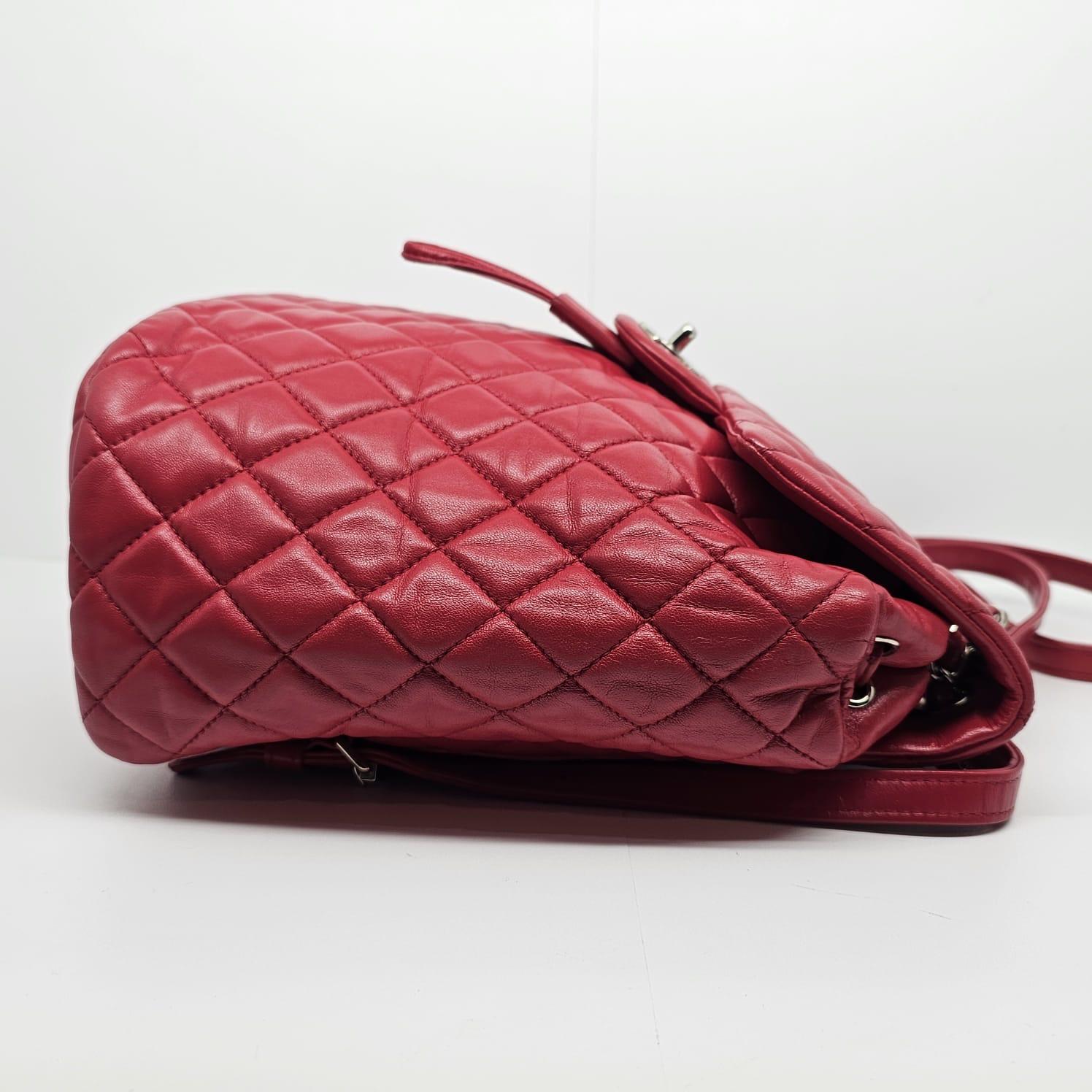Small urban spirit backpack in red lambskin with silver hardware. Overall in good condition, with slight touch ups on the leather but not too visible. Minor scuffing on the corners. Series #22. Comes with its hologram and dust bag only. 