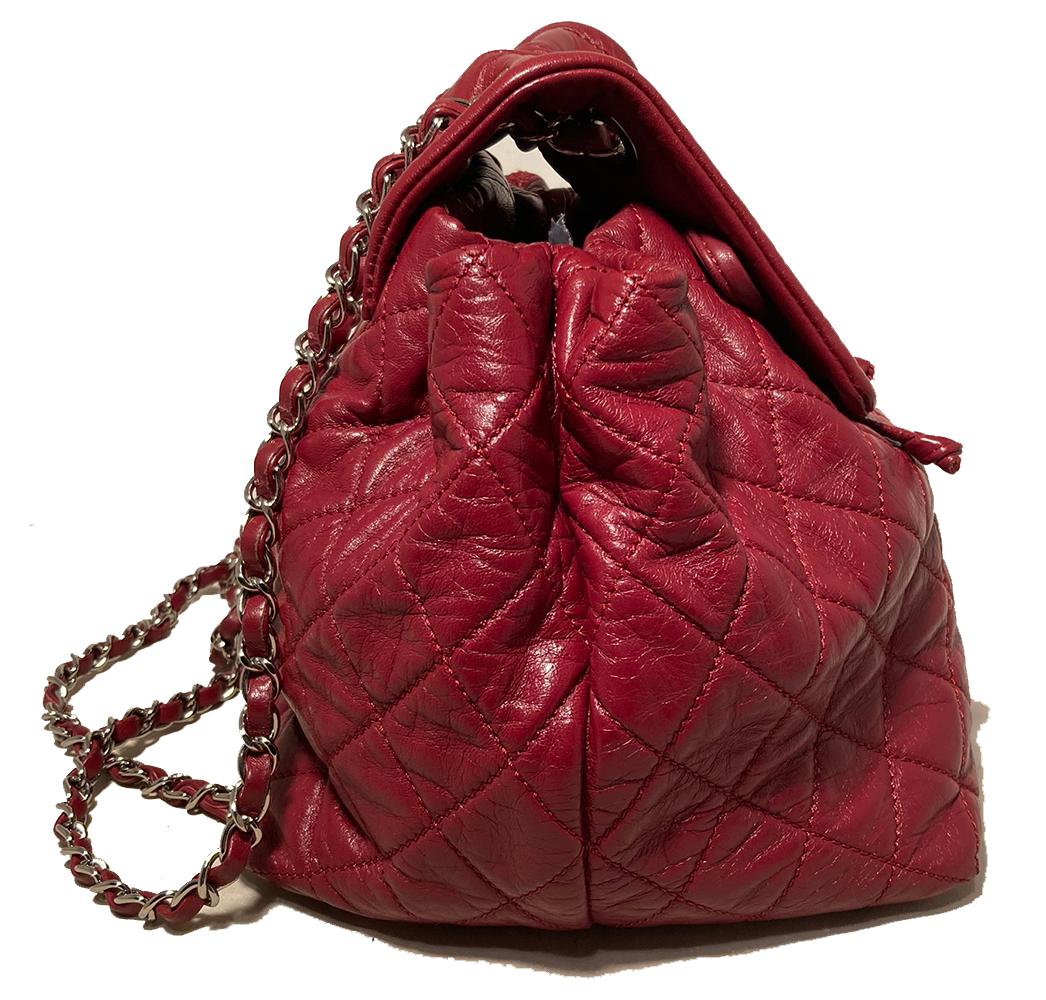 Chanel Bejing Red Leather Drawstring 2 in 1 Backpack in excellent condition. Red quilted leather exterior trimmed with silver hardware and woven chain and leather shoulder straps. Top flap opens via CC logo twist closure revealing a top drawstring