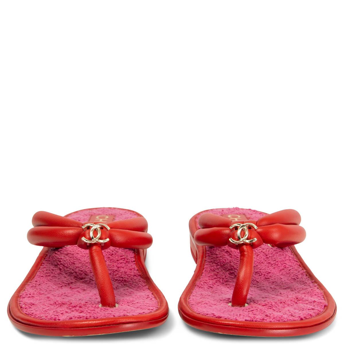100% authentic Chanel CC thong sandals in red smooth leather with pink terry cloth lining. Have been worn once ot twice and are in excellent condition. Comes with dust bag. 

Measurements
Imprinted Size	38.5C
Shoe Size	38.5
Inside Sole	25.5cm