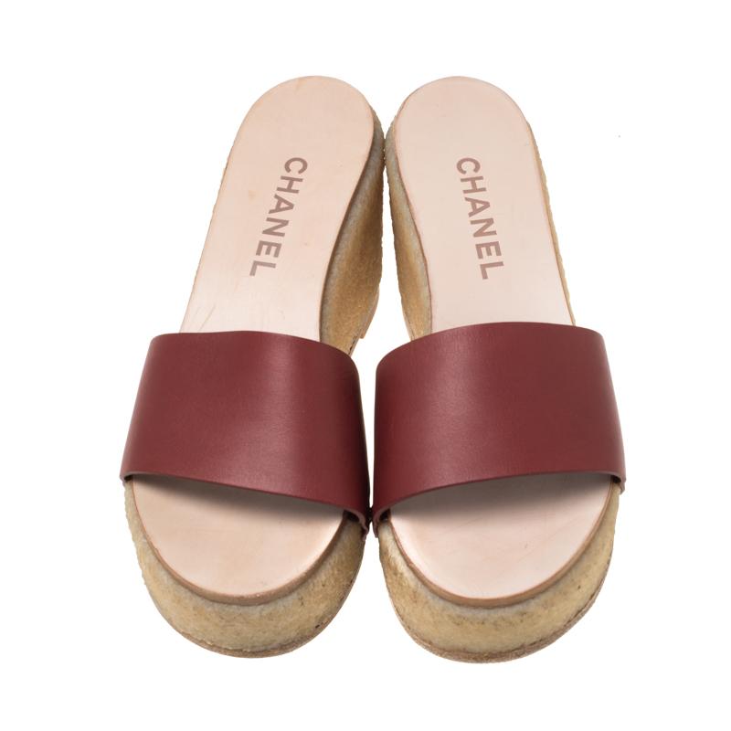 These Chanel slides can be your latest loved purchase. They feature a single leather strap in red across the vamps. The insoles are leather-lined and detailed with the label and the 9 cm wedges are sized to offer comfort.

Includes: The Luxury