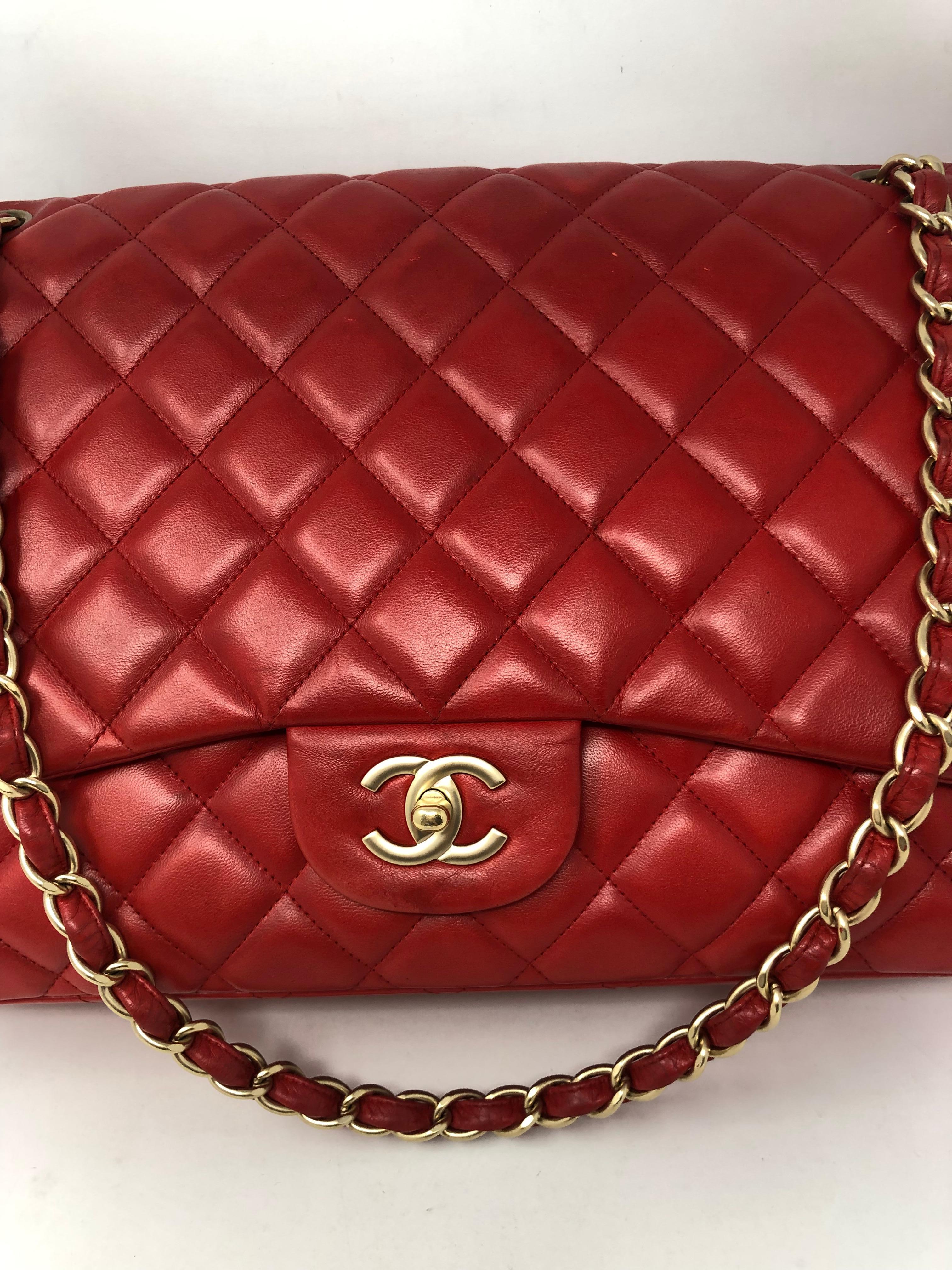 Chanel Red Leather Maxi Bag. Gold hardware. Good condition with light wear. Matte gold chain and clasp. Maxi size 13