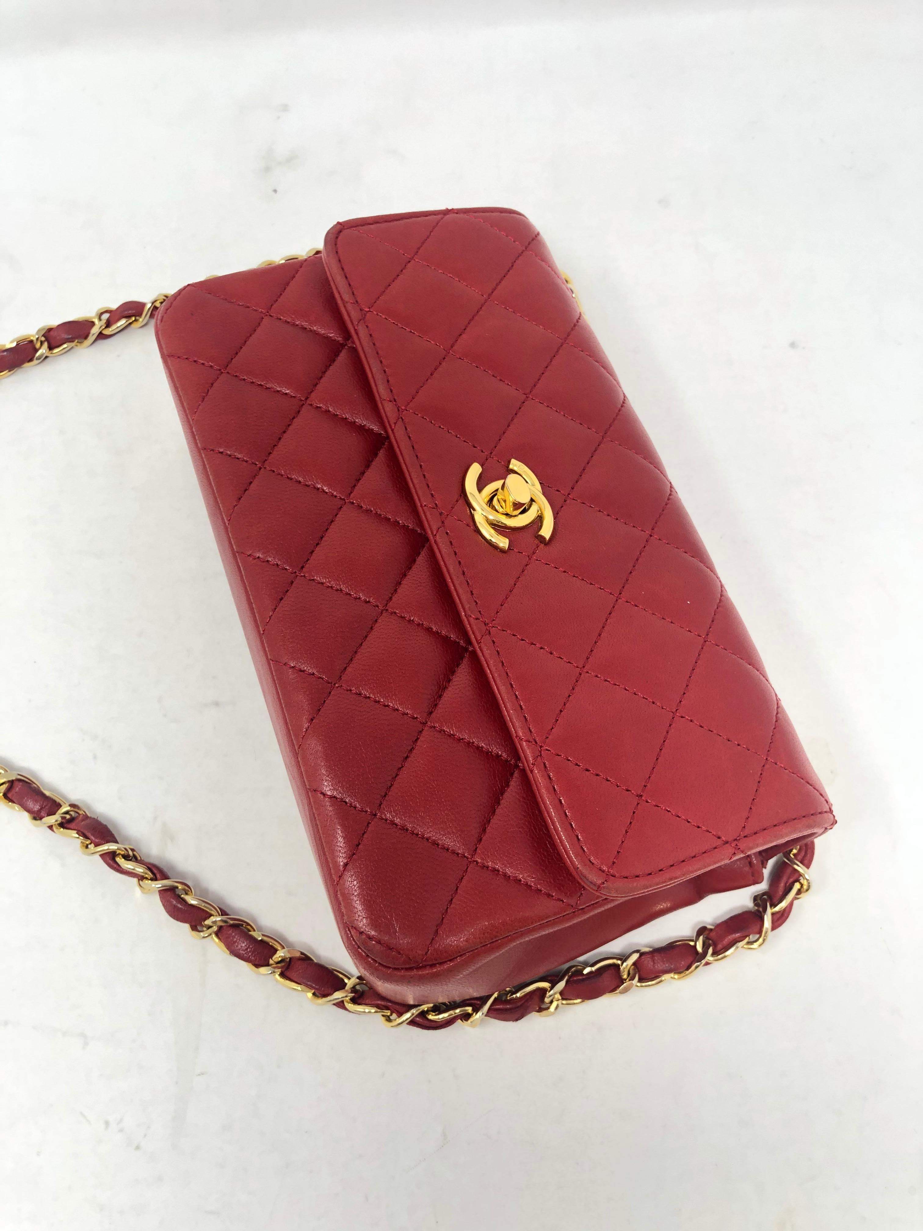 Chanel Red Mini Lambskin Crossbody Bag. Mint condition. Vintage Chanel with gold hardware. Guaranteed authentic. 