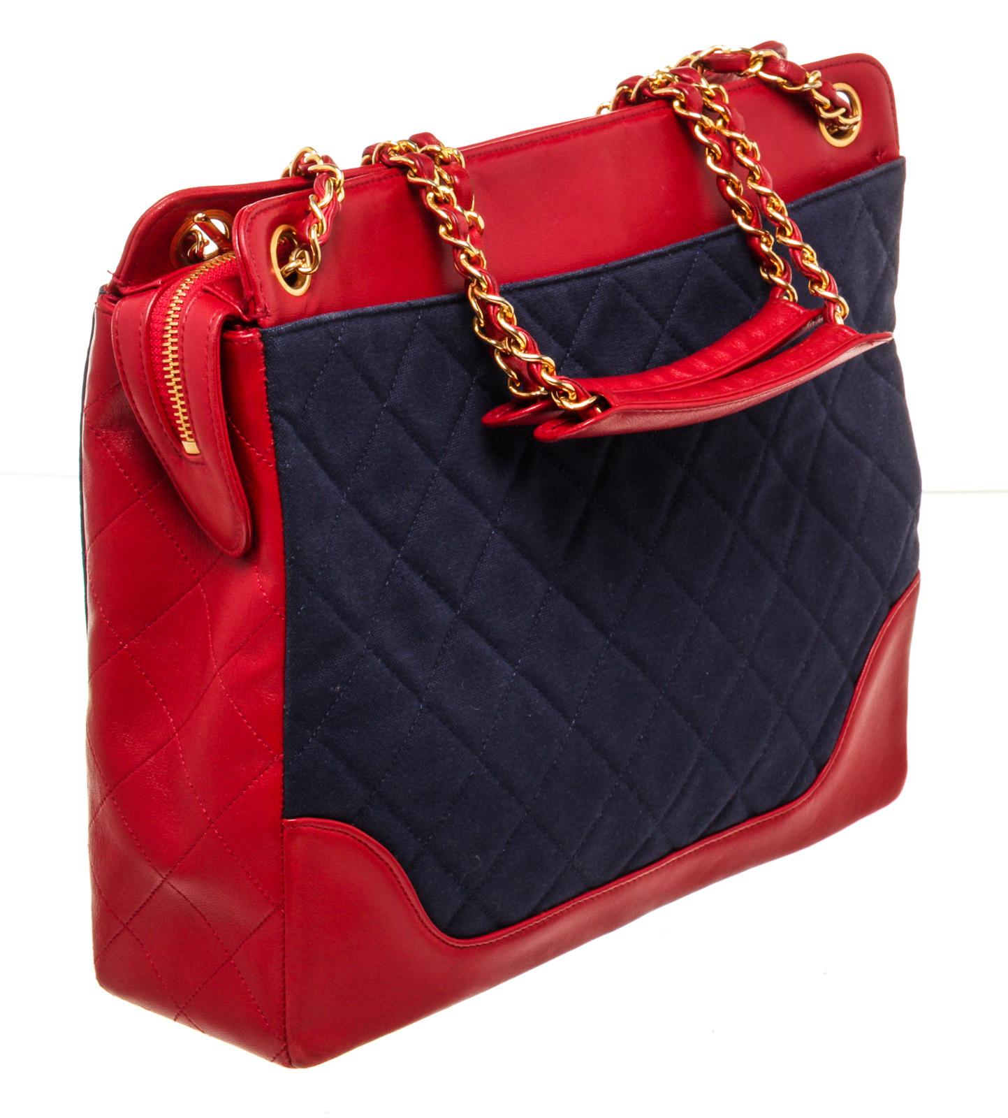 Chanel Red Nevy Denim Canvas Chain Tote Bag with canvas,Â gold-toneÂ hardware, interior zip pocket, chain shoulder strapÂ and snapÂ closure.

42964MSCÂ 