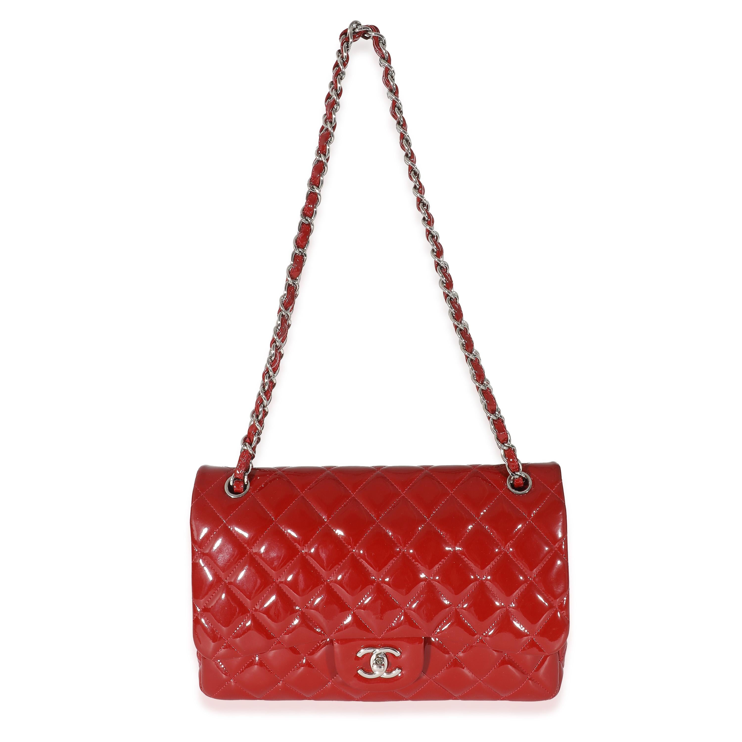 Listing Title: Chanel Red Patent Jumbo Double Flap Bag
SKU: 133768
Condition: Pre-owned 
Condition Description: A timeless classic that never goes out of style, the flap bag from Chanel dates back to 1955 and has seen a number of updates. The design