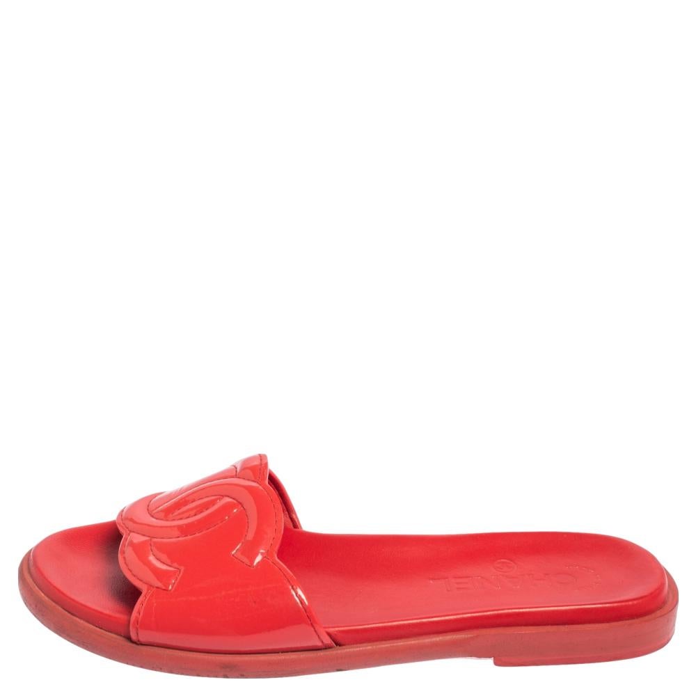 These slides from Chanel are easy to slip on. They have been crafted from glossy patent leather and designed with their signature CC logo perched on the uppers. They come in a shade of red to essay style in an effortless way.