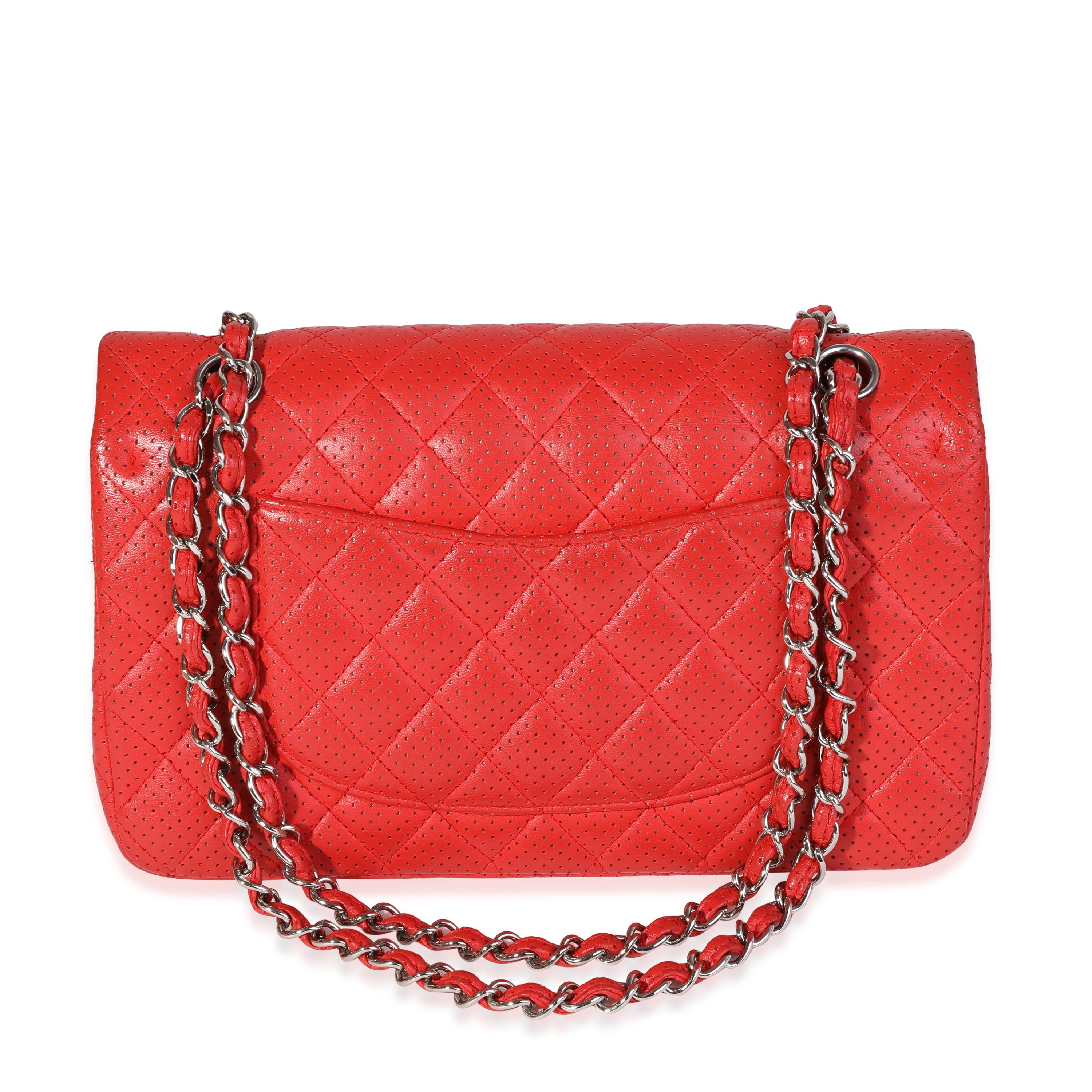 Listing Title: Chanel Red Perforated Leather Medium Classic Double Flap Bag
SKU: 120703
Condition: Pre-owned 
Handbag Condition: Very Good
Condition Comments: Very Good Condition. Light scuffing to corners and exterior. Marks and discoloration to