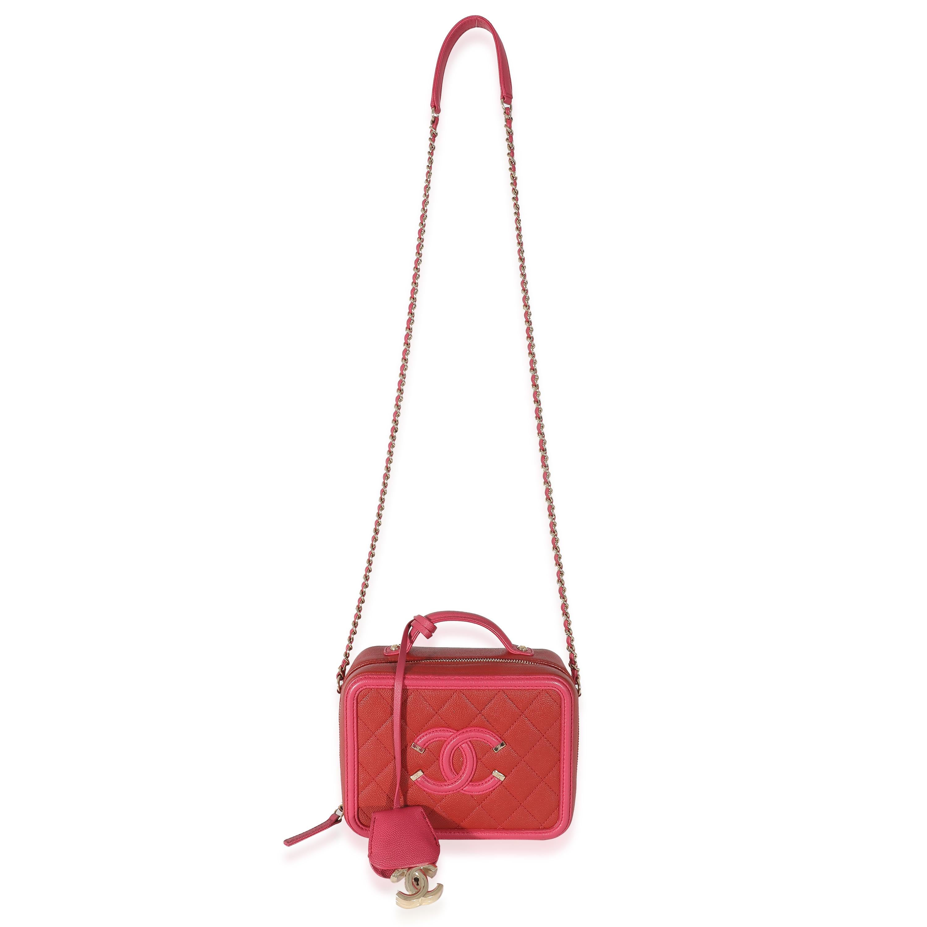 Listing Title: Chanel Red Pink Caviar Mini Filigree Vanity Case
SKU: 133160
Condition: Pre-owned 
Handbag Condition: Very Good
Condition Comments: Item is in very good condition with minor signs of wear. Exterior scuffing and discoloration