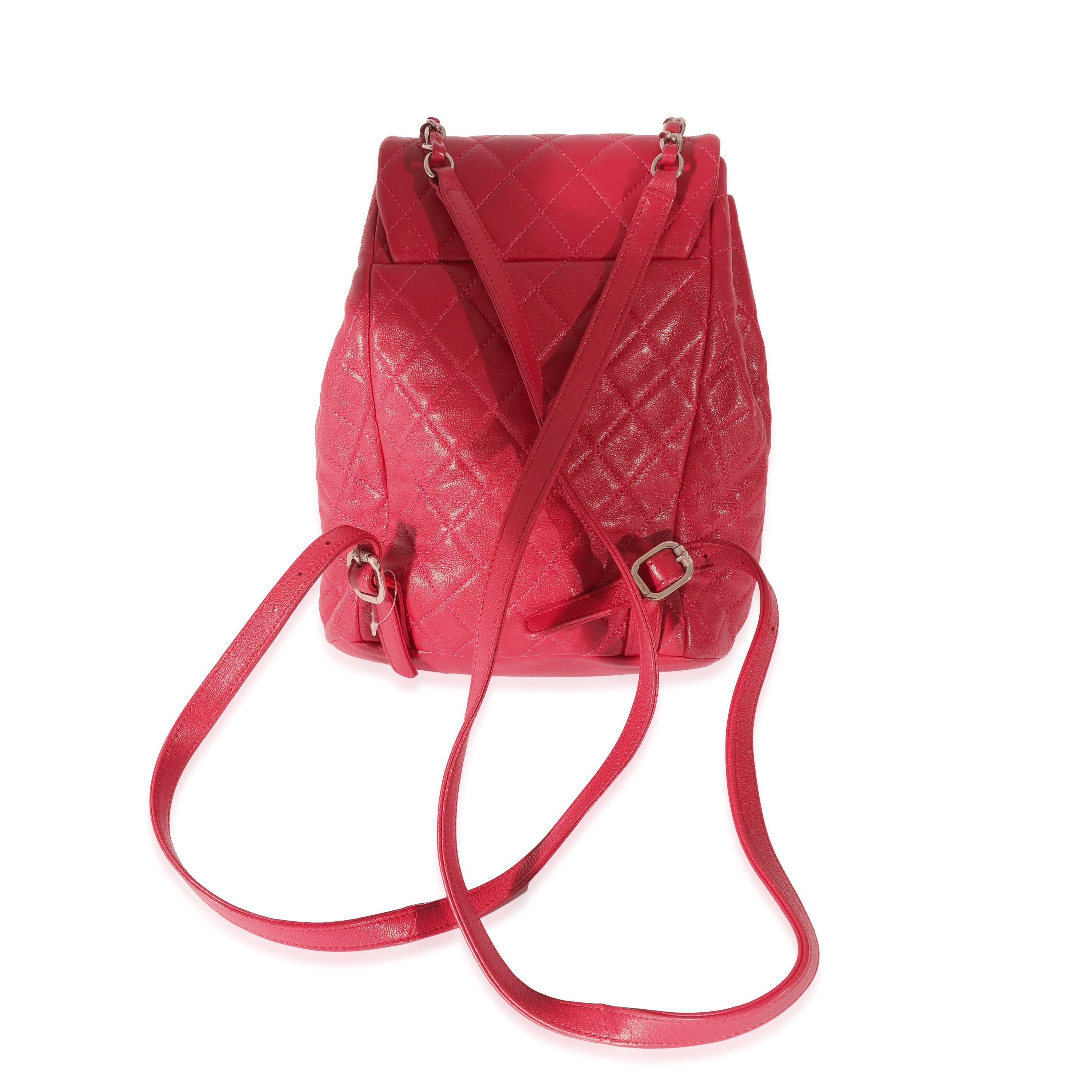 Listing Title: Chanel Red Quilted Calfskin Medium Covered CC Drawstring Backpack
SKU: 128080
Condition: Pre-owned 
Handbag Condition: Very Good
Condition Comments: Very Good Condition. Plastic at some hardware. Exterior scuffing at straps and