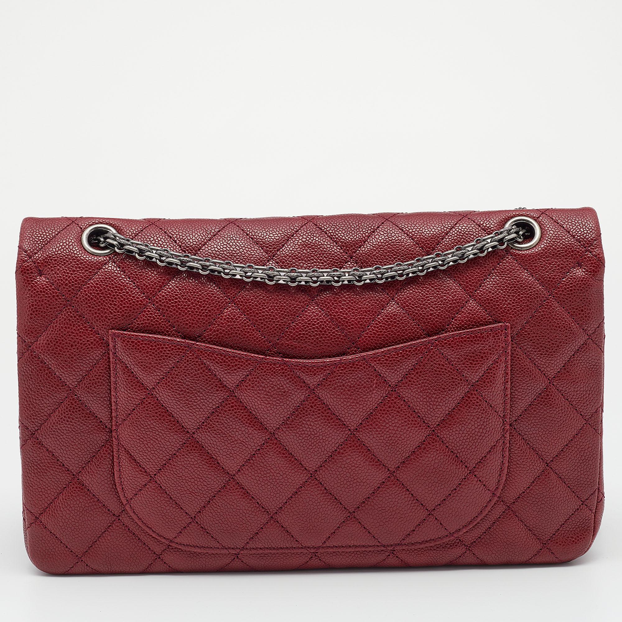 Chanel's Flap Bags are iconic and noteworthy in the history of fashion. Hence, this Reissue 2.55 is a buy that is worth every bit of your splurge. Exquisitely crafted from red leather, it bears their signature quilt pattern and the Mademoiselle lock