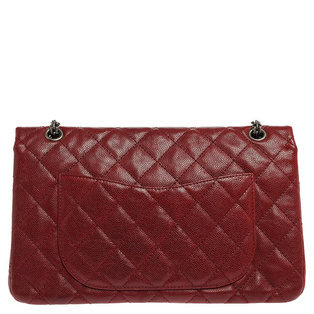 Chanel's Flap Bags are iconic and noteworthy in the history of fashion. Hence, this Reissue 2.55 is a buy that is worth every bit of your splurge. Exquisitely crafted from red caviar leather, it bears their signature quilt pattern and the iconic