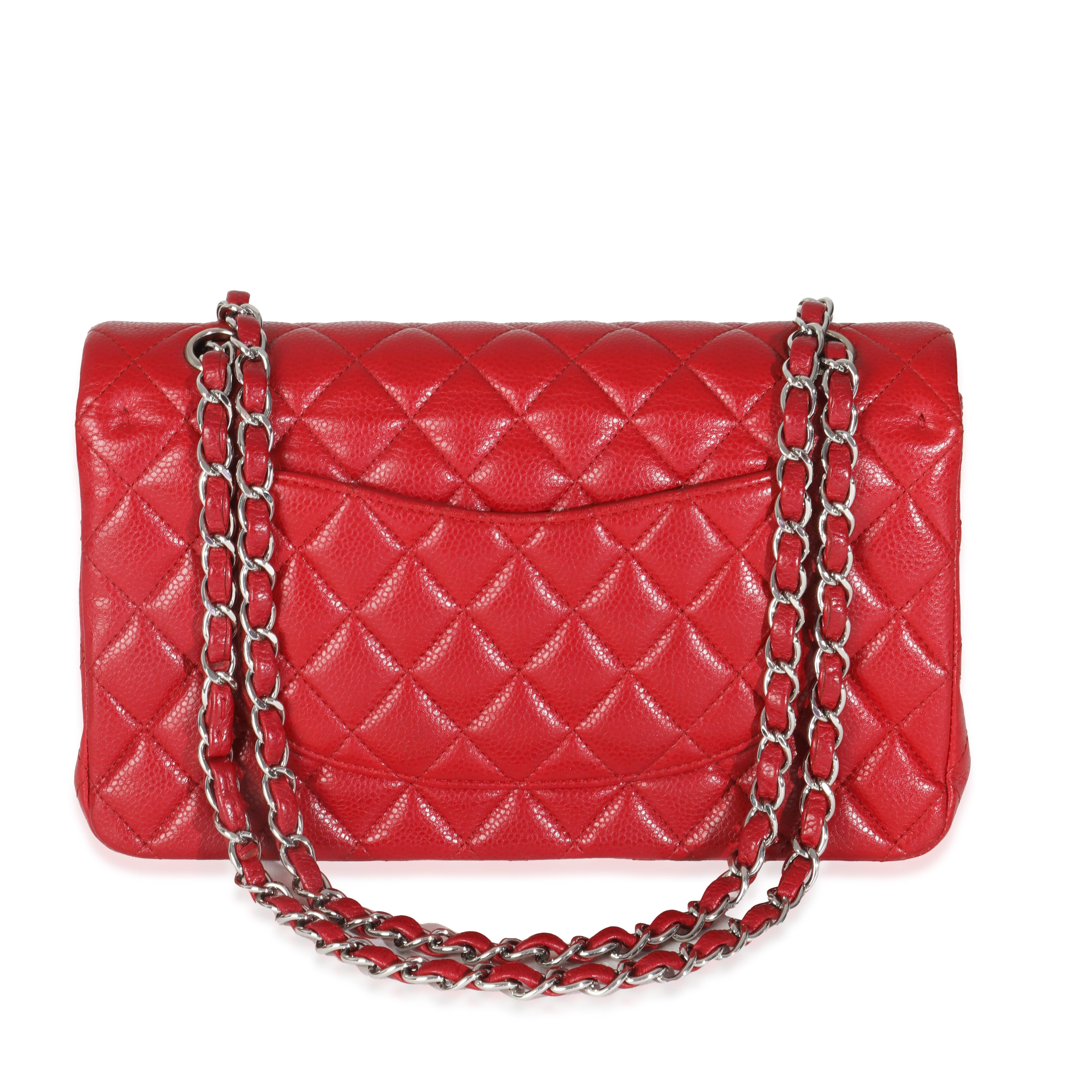 Listing Title: Chanel Red Quilted Caviar Medium Classic Double Flap Bag
SKU: O145213
Condition: Pre-owned 
Condition Description: A timeless classic that never goes out of style, the flap bag from Chanel dates back to 1955 and has seen a number of