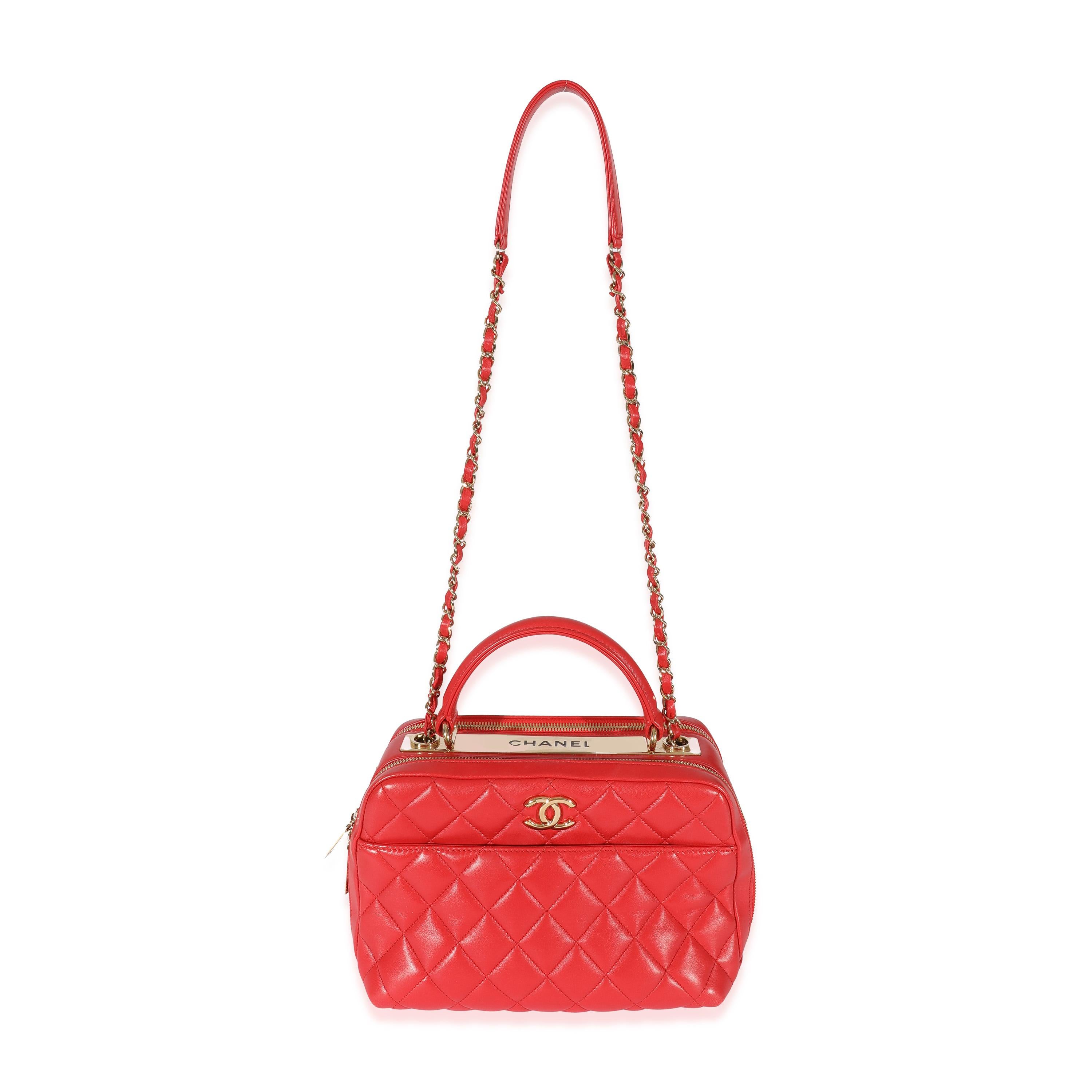 Listing Title: Chanel Red Quilted Lambskin CC Trendy Bowling Bag
 SKU: 128663
 Condition: Pre-owned 
 Handbag Condition: Very Good
 Condition Comments: Very Good Condition. Plastic on interior hardware. Scratching to exterior hardware. Scuffing and