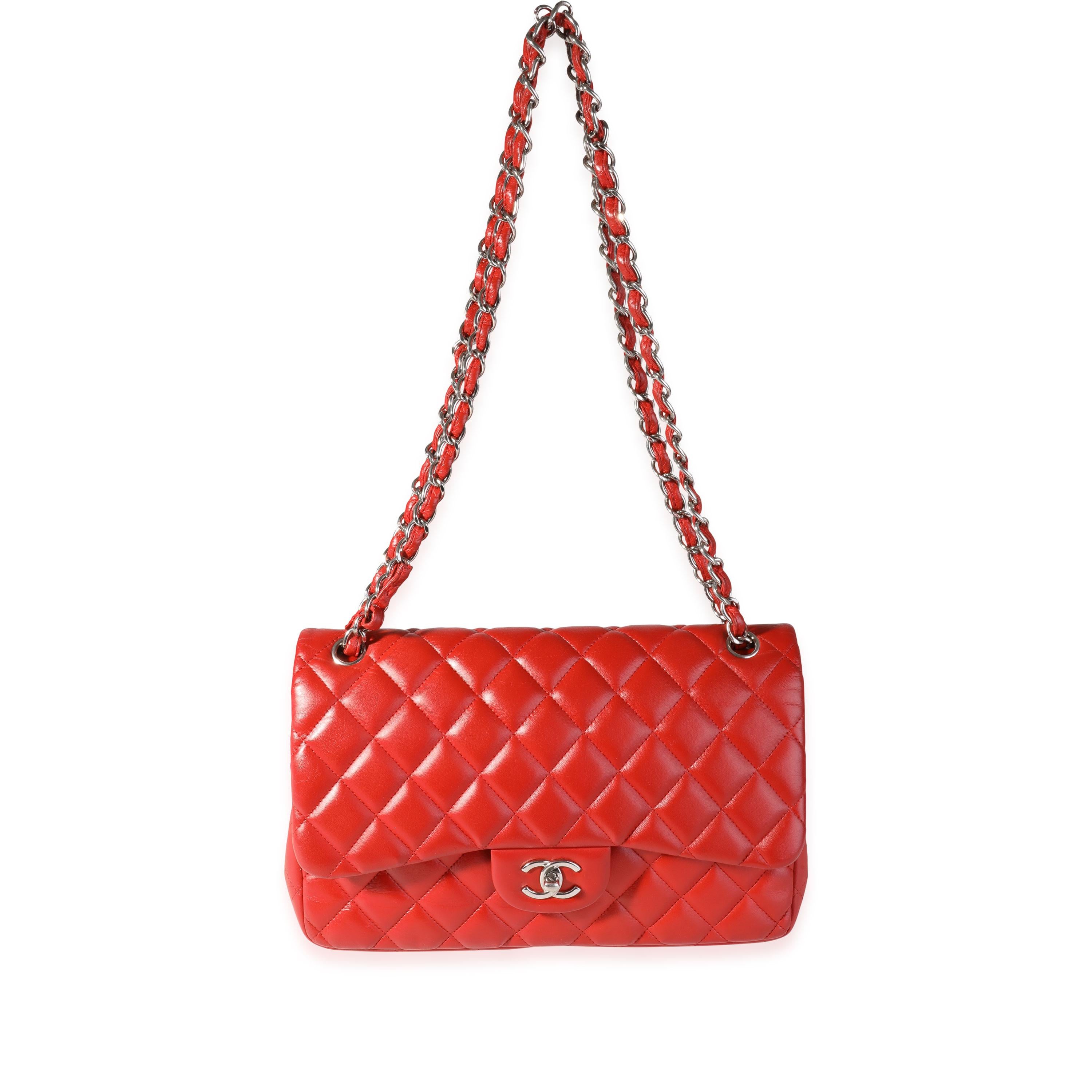 Listing Title: Chanel Red Quilted Lambskin Classic Jumbo Double Flap Bag
SKU: 119371
MSRP: 9500.00

Handbag Condition: Good
Condition Comments: Item has been repainted throughout exterior corners and interior lining. Moderate cracking at exterior