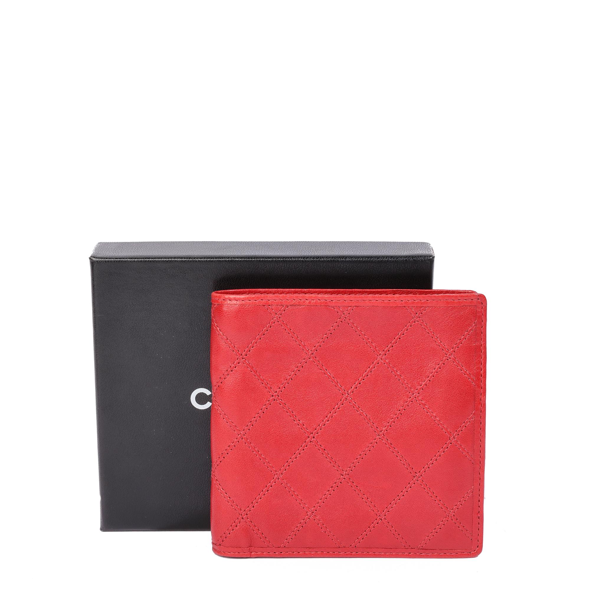 BRAND	Chanel
MODEL	Timeless Bi-Fold Wallet
AGE	1980's
GENDER	Women's
MATERIAL(S)	Lambskin Leather
COLOUR	Red
INTERIOR	Red Leather
ACCOMPANIED BY	Chanel Box
HEIGHT	11cm
WIDTH	11.5cm
DEPTH	1cm
AUTHENTICITY DETAILS	Date Stamp