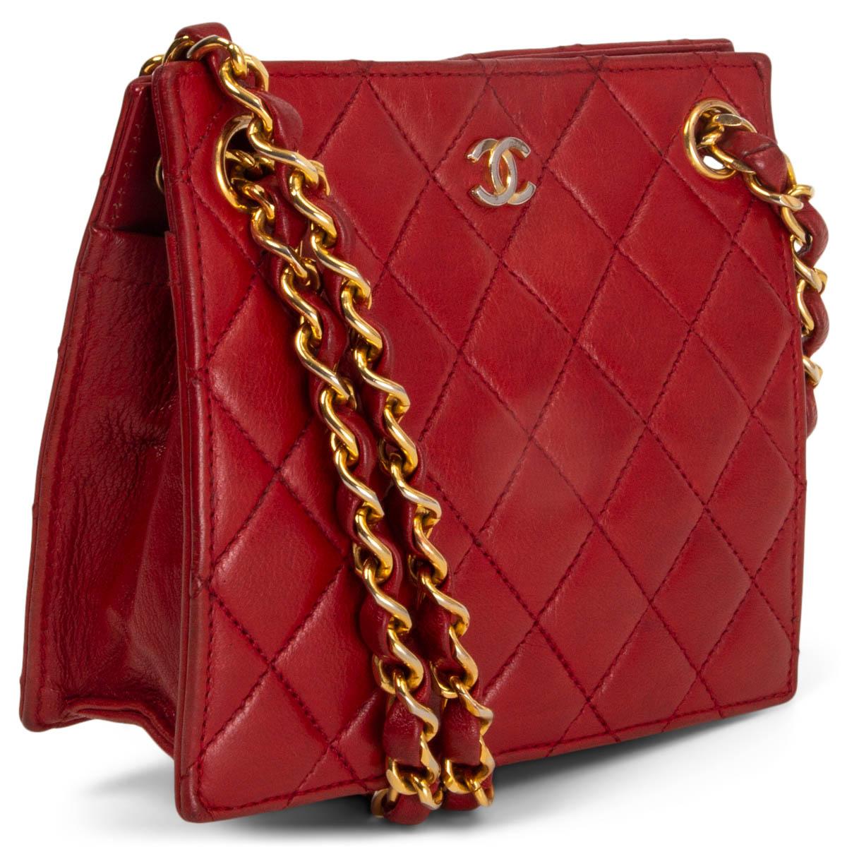 100% authentic Chanel vintage 1980's quilted square mini bag in red lambskin featuring gold-tone hardware. Opens with a push-lock on the inside and is embellished with CC logo at front. Can be carried as a shoulder bag or cross body. Has been