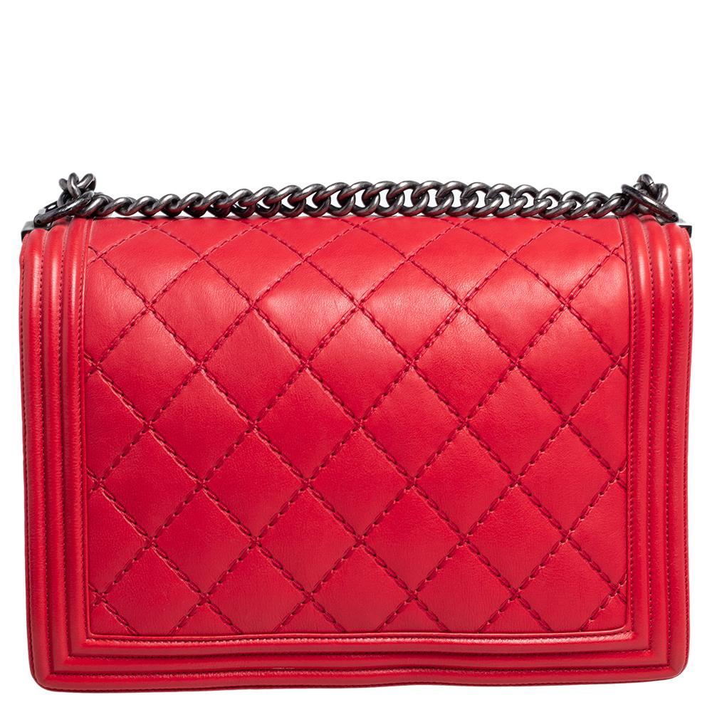 Every Chanel creation deserves to be etched with honor in fashion history as they carry irreplaceable style. Like this stunner, Boy Flap, that has been exquisitely crafted from quilted leather. It brings a red shade and the iconic CC push lock on