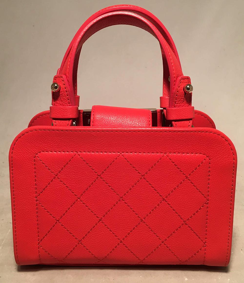 Chanel Red Quilted Leather Mini Shopping Tote Bag in excellent condition. Quilted red calfskin leather exterior trimmed with gold hardware. Double handles and chain and leather shoulder strap easily convert between hand and shoulder styles. Top snap