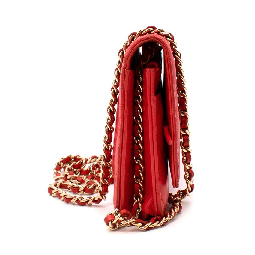 Chanel Red Quilted Leather Wallet on Chain
 

 - A Chanel red caviar wallet with the signature chain and diamond-quilted body
 - Can be worn as a shoulder bag or crossbody
 - Bright red colour with a pinky-hued undertone 
 - The inside features