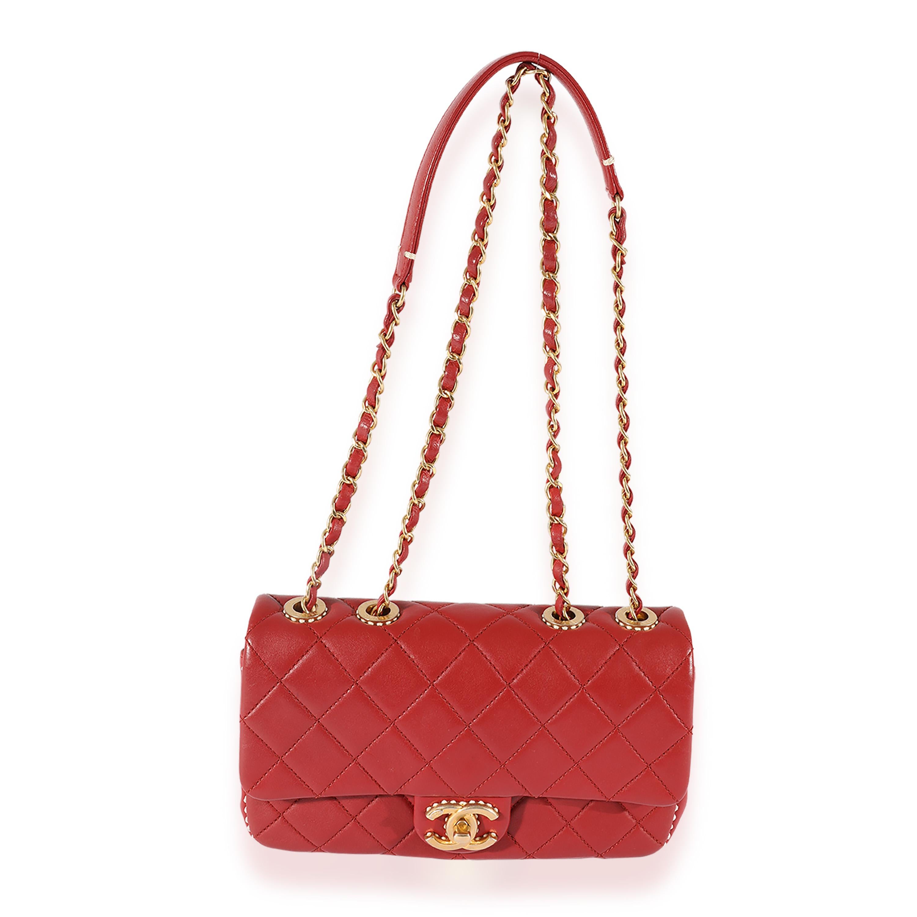 Listing Title: Chanel Red Quilted Leather White Stitch Flap Bag
SKU: 125360
Condition: Pre-owned 
Handbag Condition: Very Good
Condition Comments: Very Good Condition. Faint scuffing to exterior leather. Scuffing to interior leather. Light