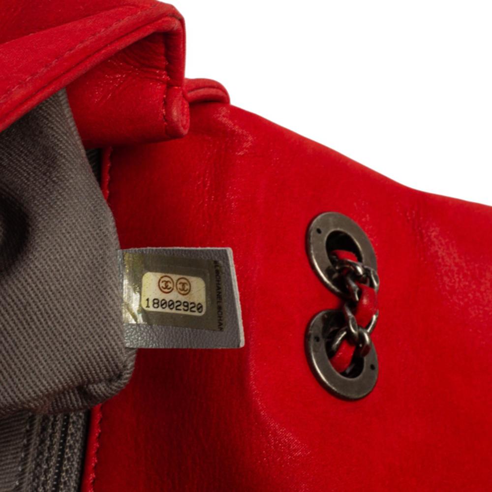 The bag to invest in this season is this creation by Chanel. Fashioned using nubuck leather, the red flap bag has a compact size with a leather-lined interior and the exterior is covered with crochet stitches forming the diamond quilt. A signature