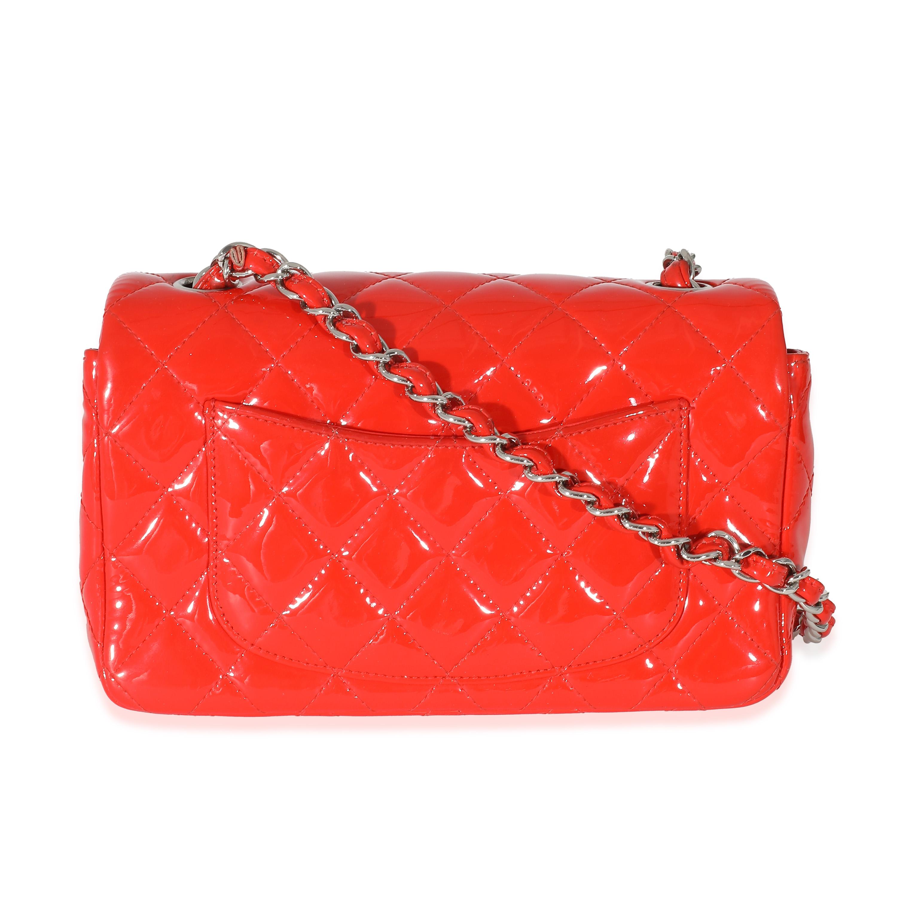 Listing Title: Chanel Red Quilted Patent Mini Rectangular Flap Bag
SKU: 133423
Condition: Pre-owned 
Condition Description: A timeless classic that never goes out of style, the flap bag from Chanel dates back to 1955 and has seen a number of