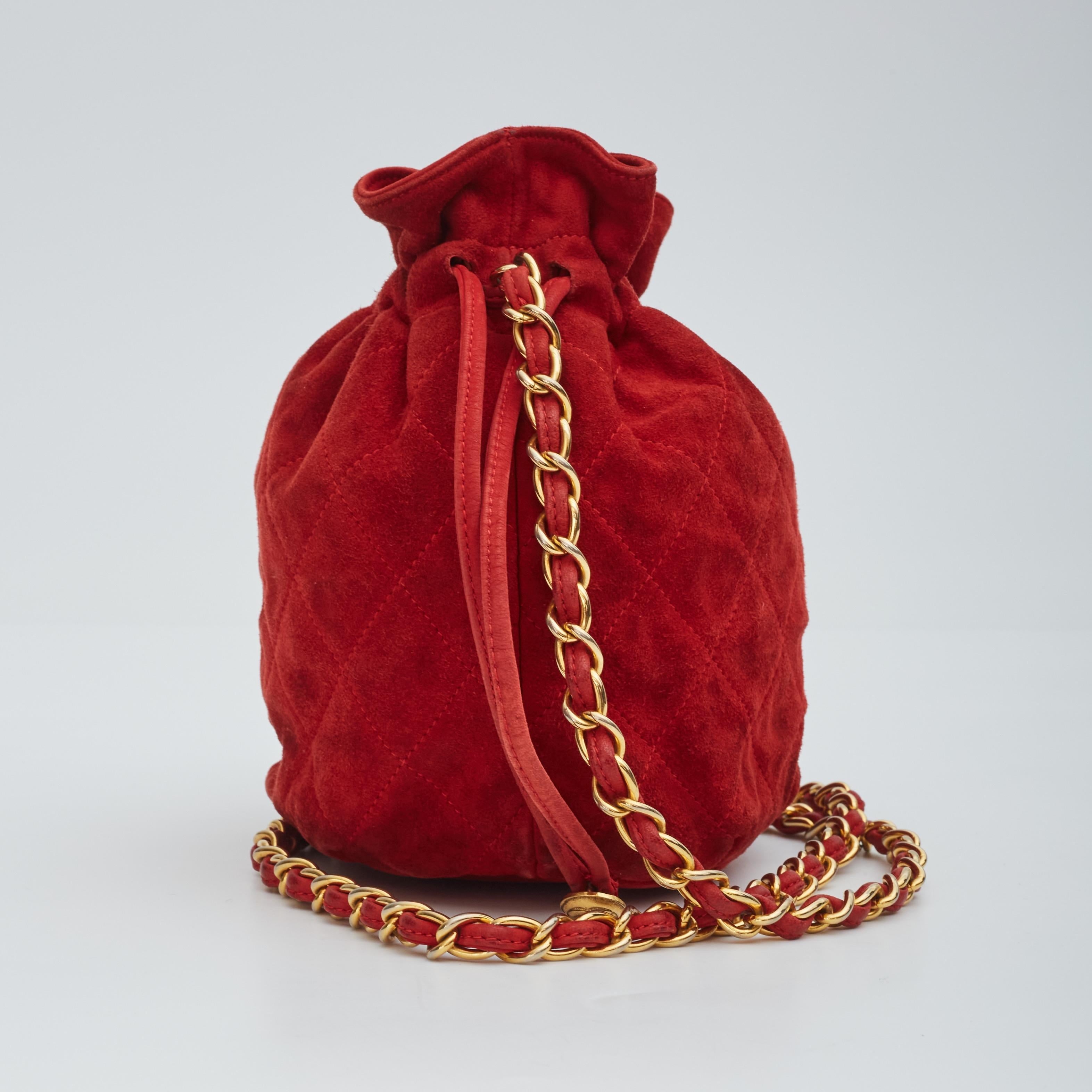 Chanel Red Quilted Suede Mini Drawstring Crossbody Pouch Bucket Bag Leather  ref.577371 - Joli Closet