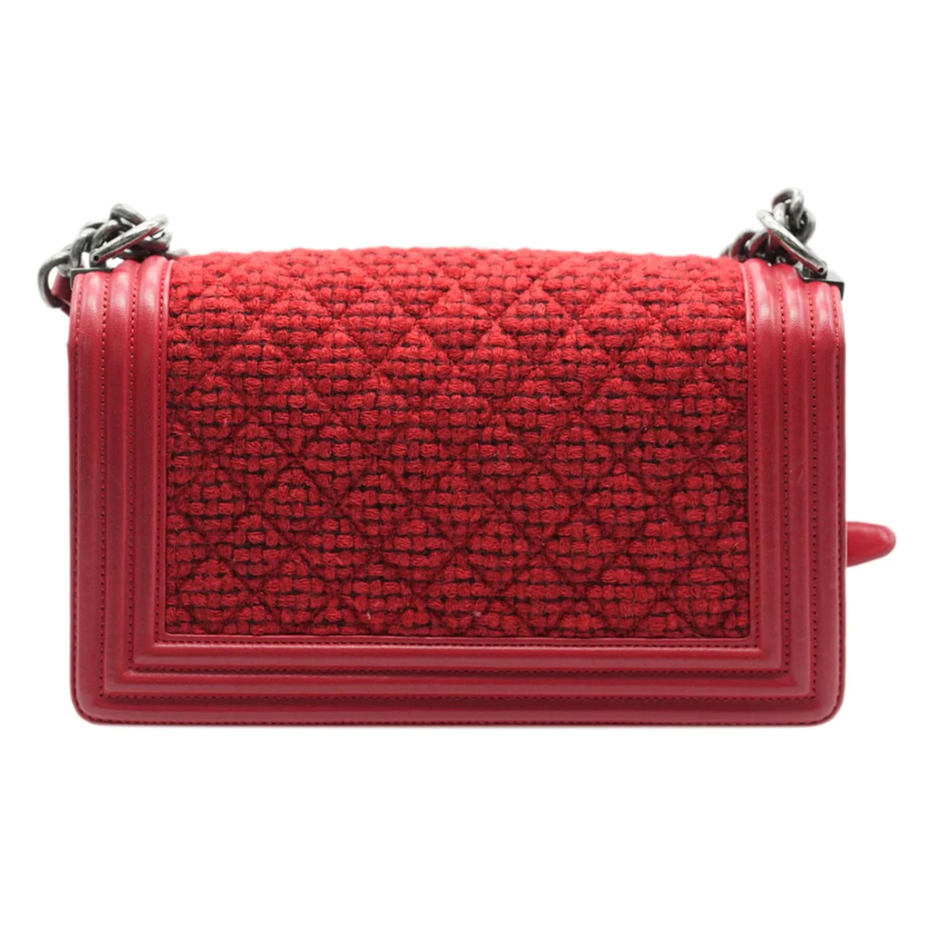 Listing Title: Chanel Red Quilted Tweed Lambskin Old Medium Boy Bag
SKU: U138403
Condition: Pre-owned 
Handbag Condition: Very Good
Condition Comments: Item is in very good condition with minor signs of wear.  Scuffing to corners. Scratches and