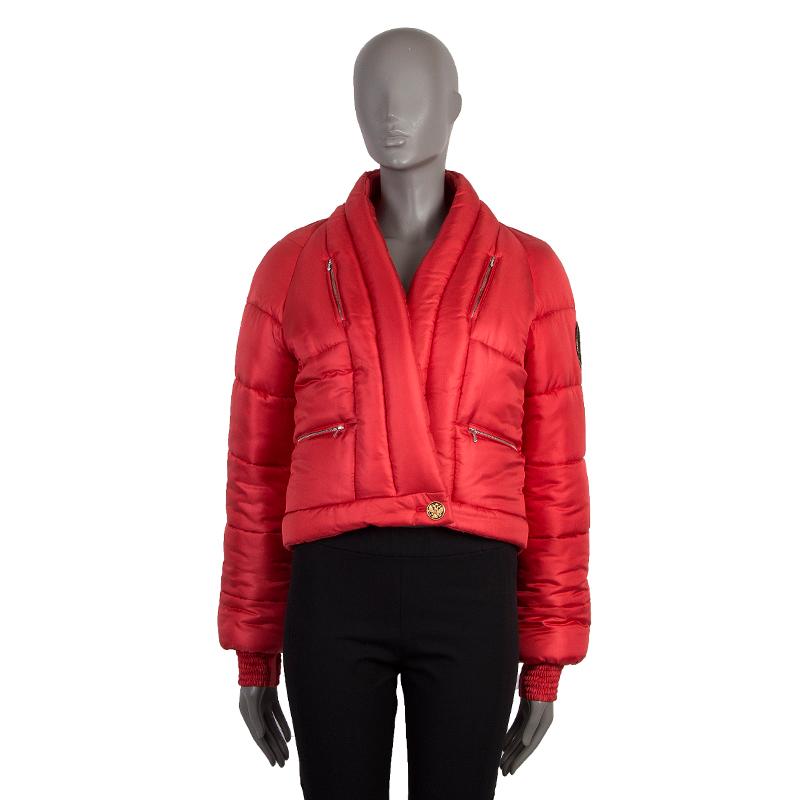 Chanel 'Paris - Moscow' double-breasted down jacket in coral silk (100%). With v neck, ribbed cuffs, CC crest patch on one arm, and four zipper pockets on the front. Closes with one black and golden CC crest button and one concealed butoon on the