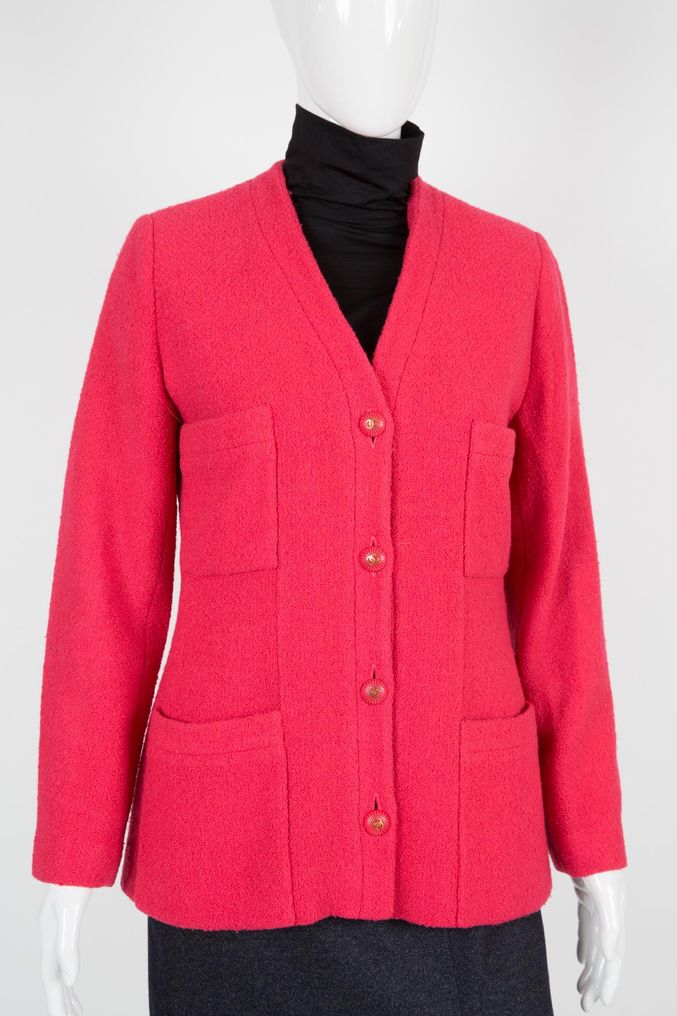 Chanel strawberry pink wool boucle tweed jacket featuring a V-neck buttoned, logo-embossed buttons, buttoned cuffs, multiple patch pockets, a silk lining and a straight hem.
100% silk 
Chanel label size: 40fr/US8/UK12
In excellent vintage condition.