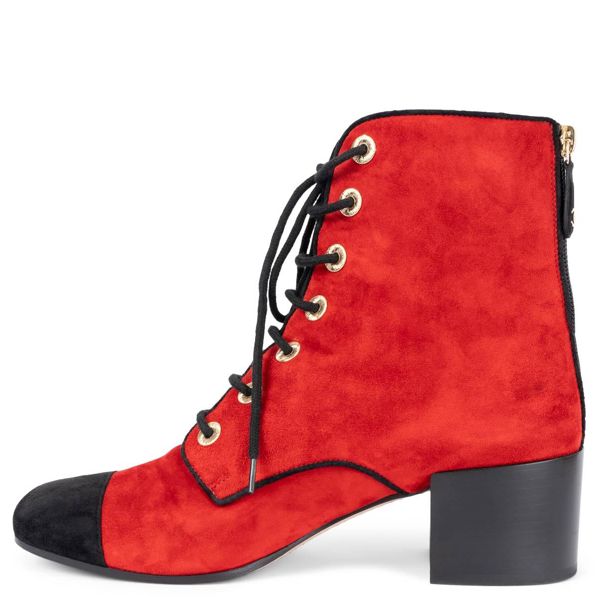 100% authentic Chanel block-heel lace-up boots in red suede with black cap toe. The design features textured gold-tone shoelace eyelets and a CC logo zipper on the heel. Have been worn and are in excellent condition. 

2019