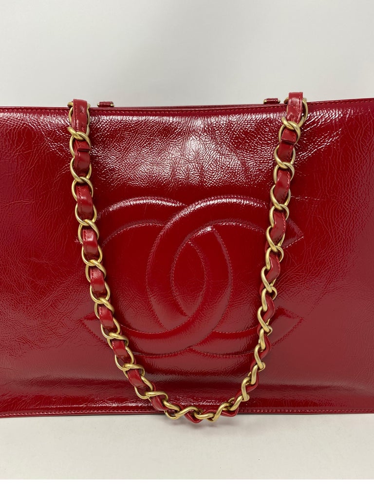 Chanel Red Tote. Gold hardware. New with authenticity card. Beautiful bright red leather bag. Can hold a lot. Don't miss out on this one. Includes authenticity card. Guaranteed authentic. 
