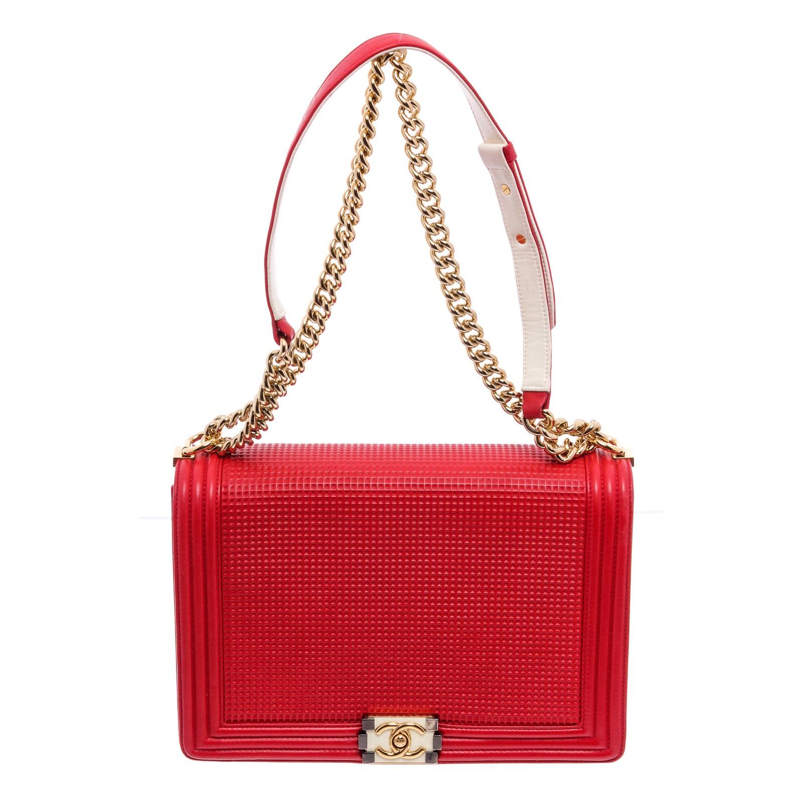 Red waffle quilted calfskin leather Chanel Large Cube Boy bag with gold-tone hardware, single chain-link shoulder strap with ivory leather shoulder guard, navy grosgrain lining, three pockets at interior walls; one with zip closure and CC turn-lock