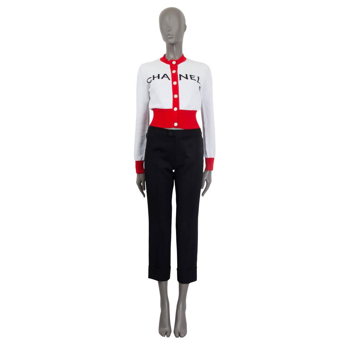 100% authentic Chanel 2019 cropped cardigan in white, red and black cotton (97%) and elastane (3%). Features the 'Chanel' logo in black on the front and long sleeves. Opens with six 'CC' metal buttons on the front. Unlined. Has been worn once or