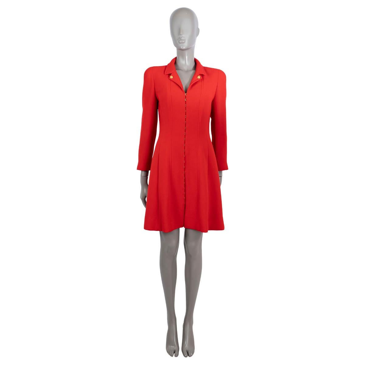 100% authentic Chanel vintage coat in red wool (100%). Features a tailored and flared silhouette, notched lapels with CC buttons, padded shoulders, buttoned cuffs and two slit pockets at the waist. Closes with gold-tone hook and eye on the front and