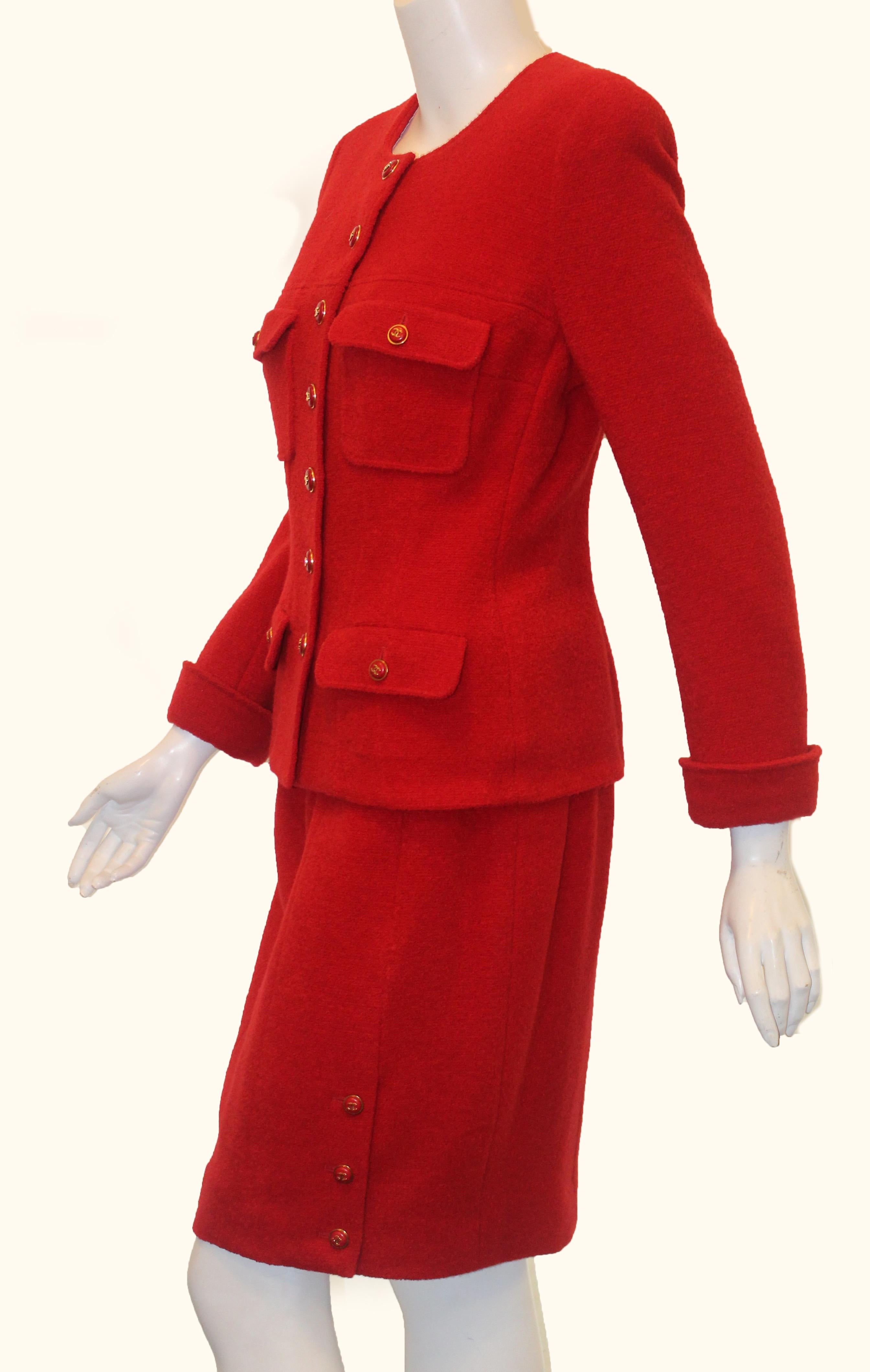 Chanel vibrant red wool and silk four flap pocket with seven CC red & gold tone buttons for closure.  This Chanel suit from the 1995 Fall Collection is in pristine condition, as if today was 1995 and you were shopping at Bergdorf Goodman.  This