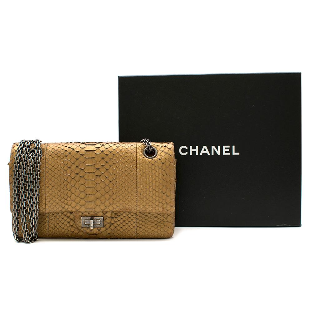 Chanel Reissue 225 Double Flap Bag in Matte Gold Python with Ruthenium Hardware. Fully lined in Gold Lambskin. 
2012

Includes Box. 
Size: 225

24cm x 14cm x 7cm