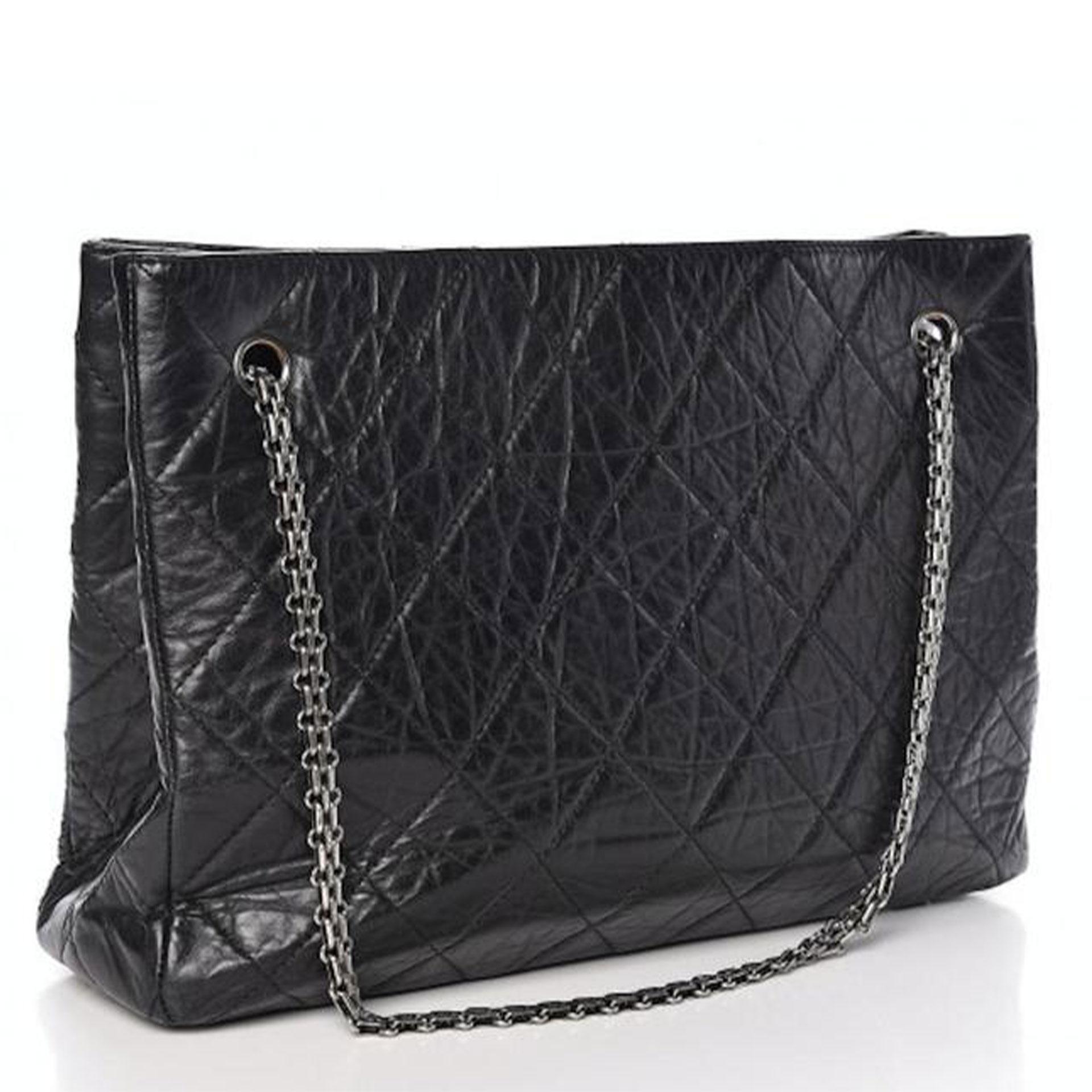 Chanel Reissue 2.55 Computer Laptop Work Business Classic Tote Bag 

Aged silver-tone hardware accents
Quilted diamond stitch aged calfskin leather
Chanel's signature reissue chain straps
Decorative mademoiselle turn-lock 
Magnetic snap closure 
Red