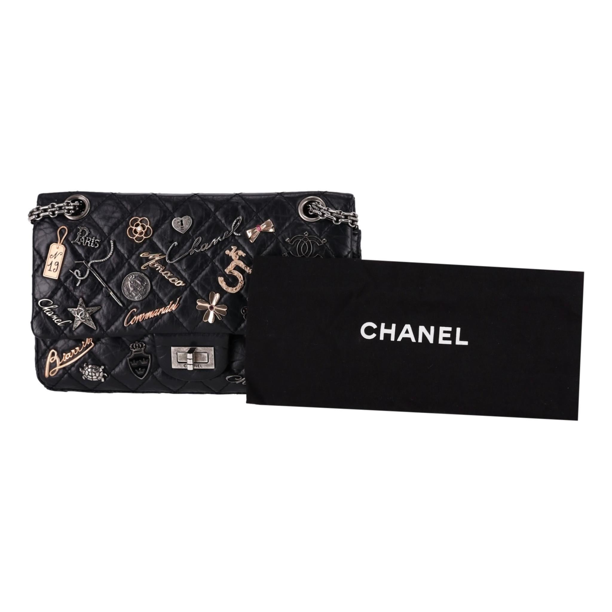 Limited Edition - Chanel Reissue 2.55 Lucky Charm Double Flap Leather Bag

Black shoulder bag crafted from aged, diamond quilted calfskin leather.

Adorned with multiple charms with Chanel's characteristic iconic symbols.

Detailed with Mademoiselle