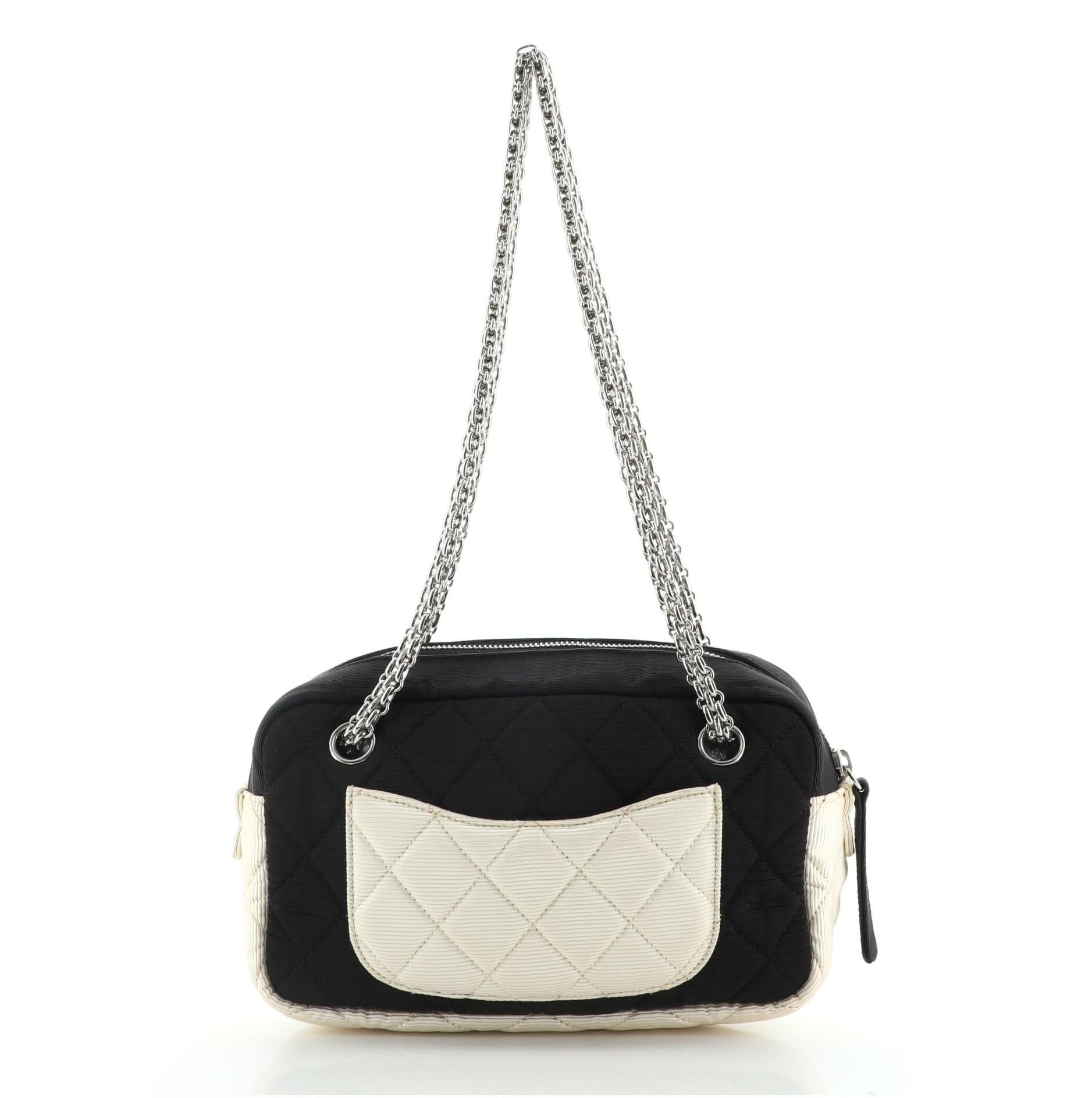 Chanel Reissue Camera Bag Quilted Grosgrain Small
Black Neutral Grosgrain

Condition Details: Odor in interior. Creasing on exterior, moderate discoloration and stains on rear pocket and base trim, scratches on hardware.

59067MSC

Height 5
