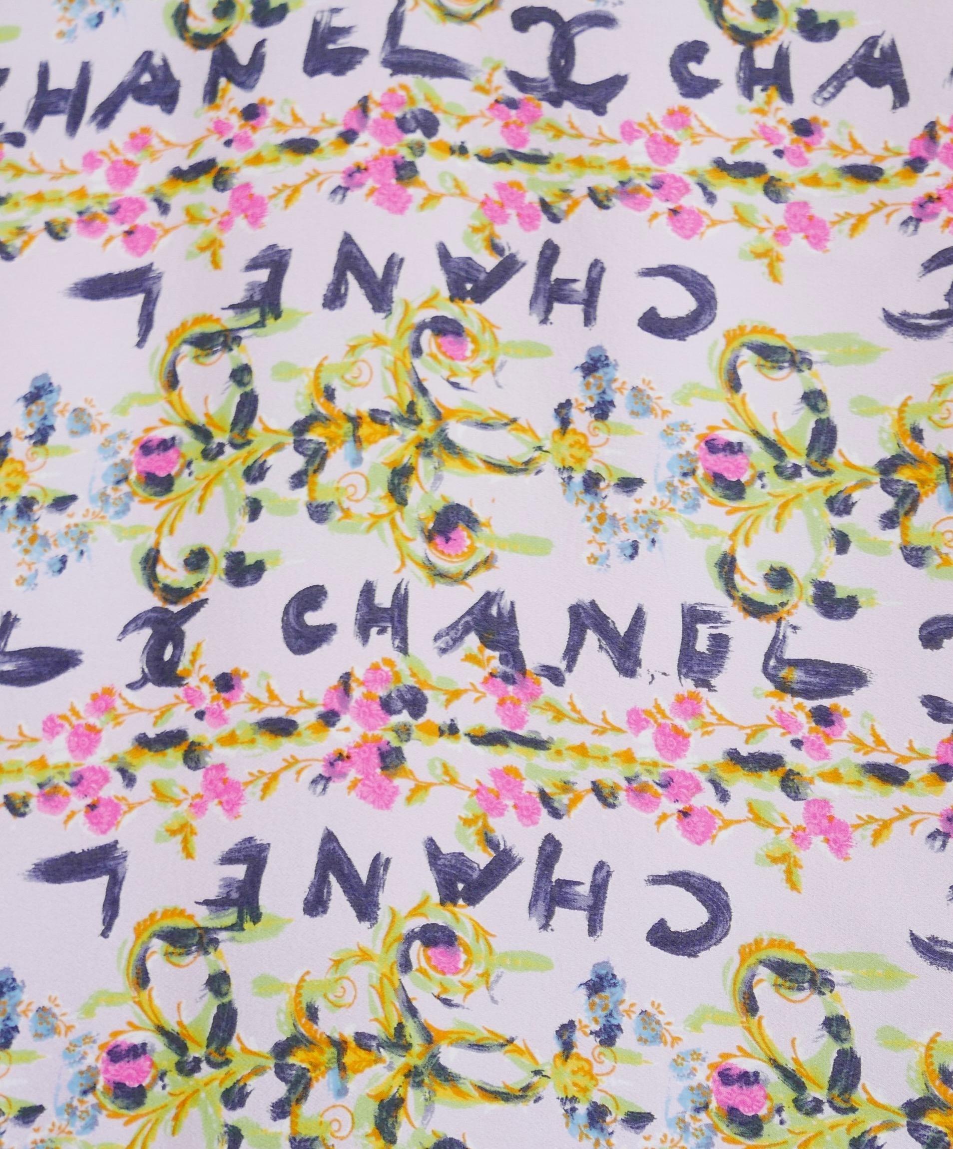 Rarest vintage Chanel shawl scarf from the Cruise 1994 collection - brand new with tags! I doubt you’ll ever see one like this again. Made from super soft pink silk with painterly swagged floral logo print and black and white braided edging. Very