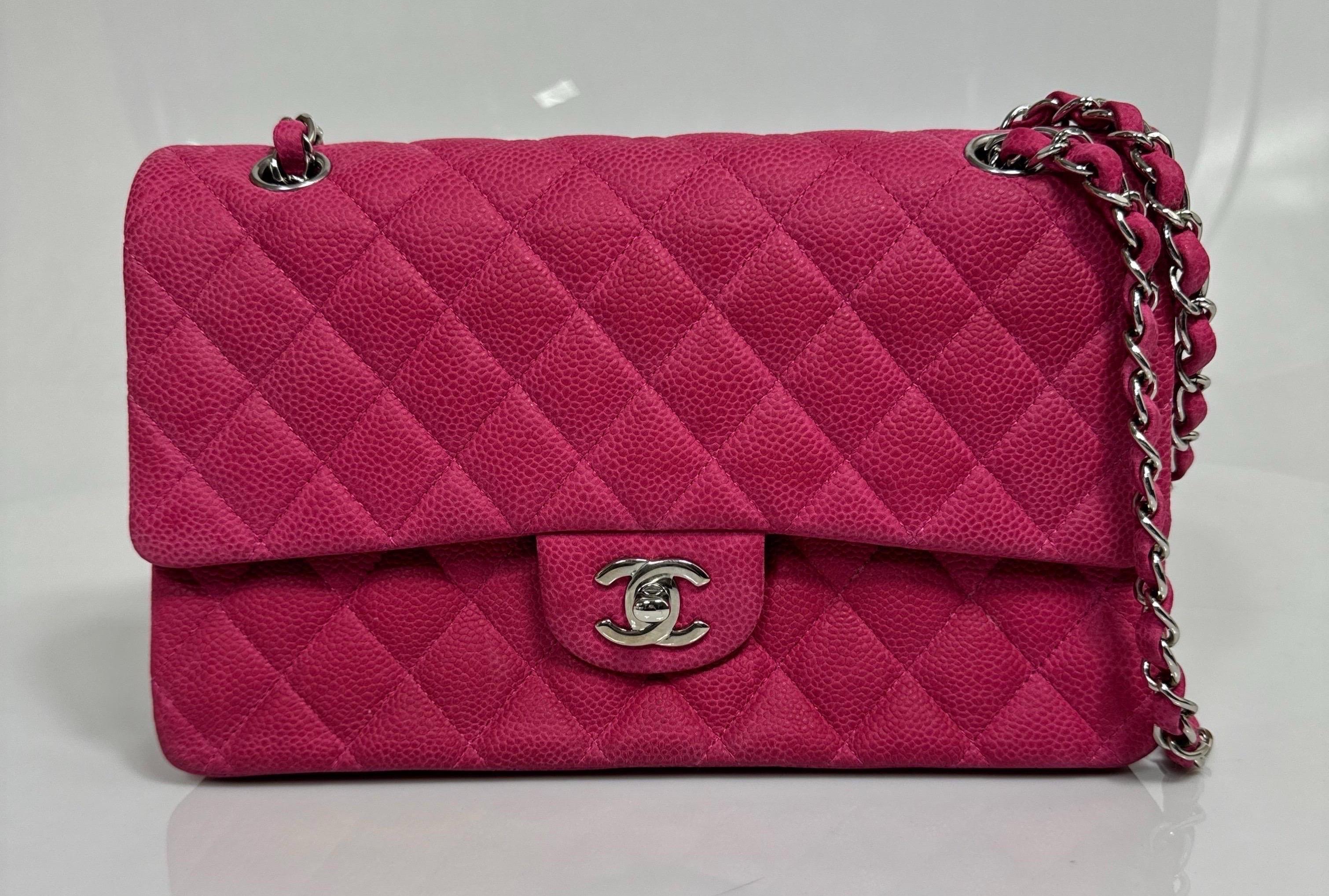Chanel Resort 2013 Fuchsia Pink Matte Caviar Medium Double Flap Classic -SHW This Chanel Medium timeless classic double flap from the Resort/Cruise 2013 Collection is in fuchsia pink matte quilted grained caviar leather, and polished silver