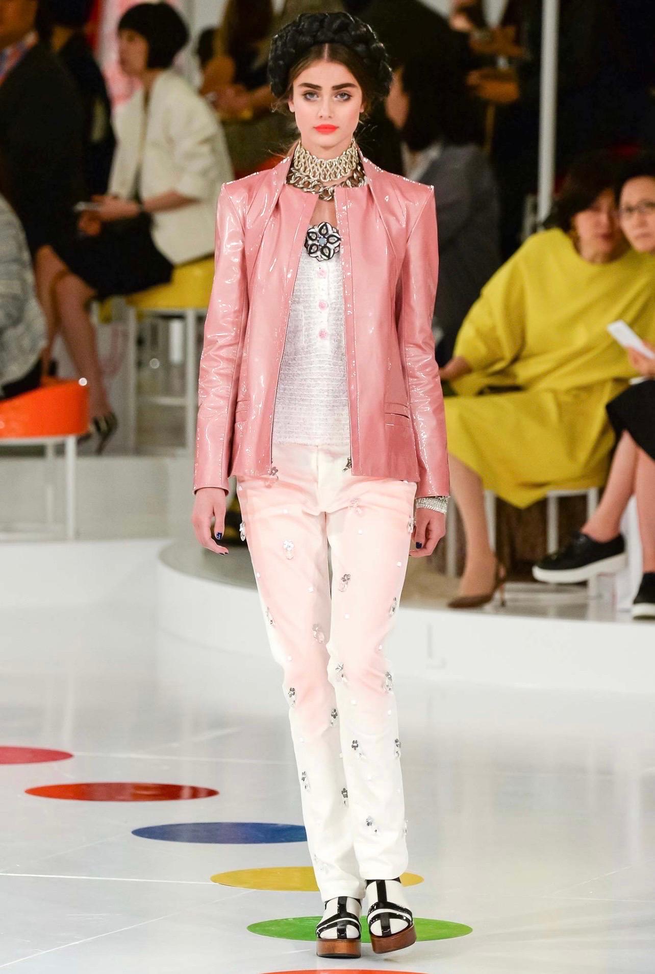 What's better than a luxe summertime tweed? Chanel took their popular and iconic tweed and made it into a spring/summer silhouette. This is look 32 from Chanel's Resort Line for 2016 that is featured in a gorgeous and understated white and pink