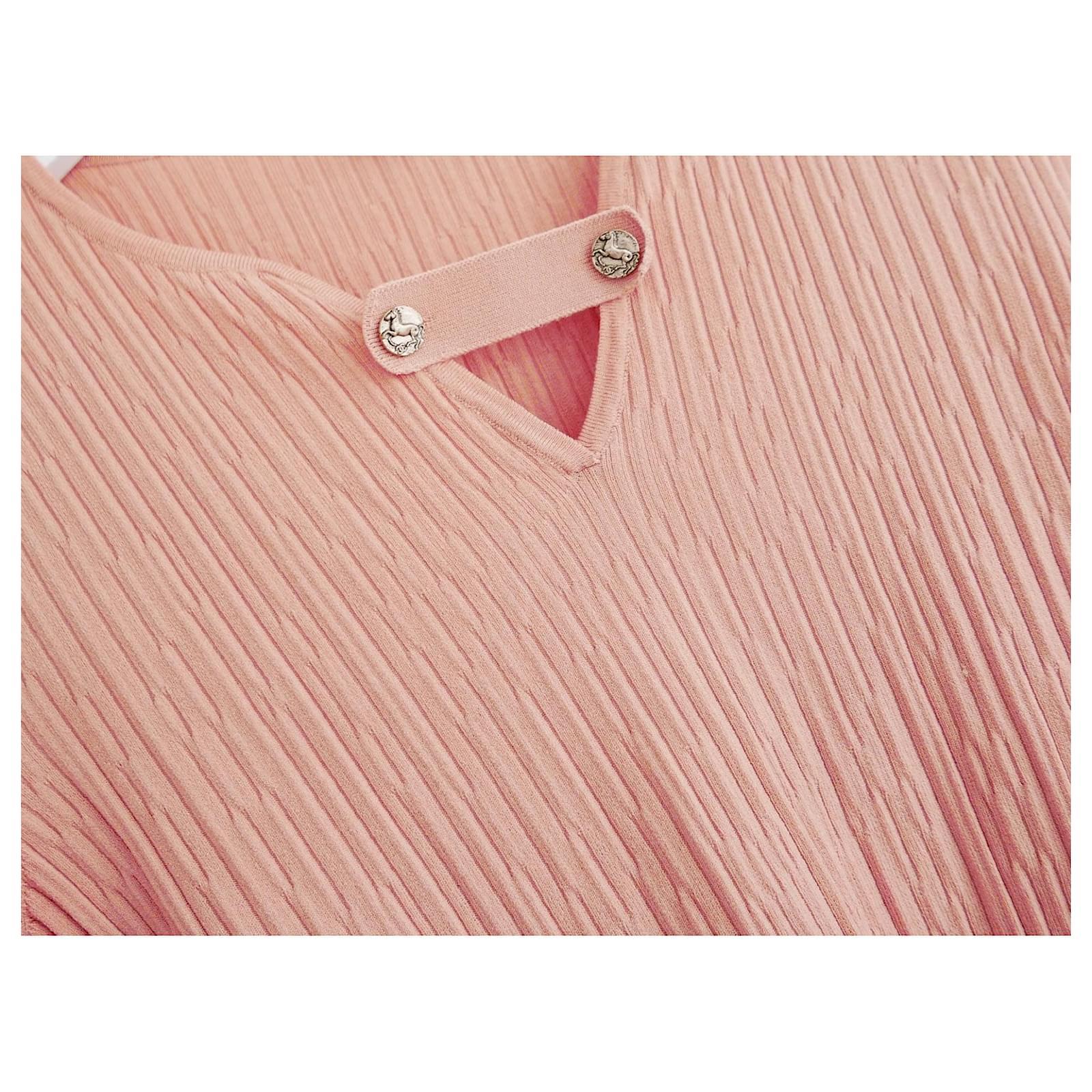 Gorgeous Chanel knit top from the Resort 2018 Collection. Unworn. Made from crinkle textured, super stretchy salmon pink coloured cupro and polyester knit with deep ribbed hem and cuffs. It has V neck with removable strap detailing attached with
