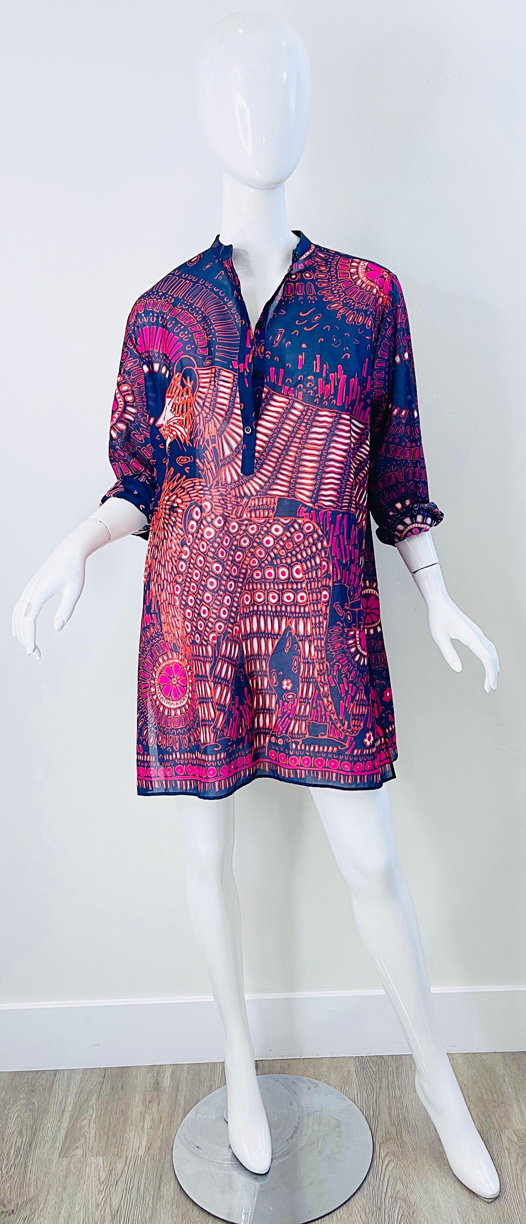 Amazing Christian Dior Resort 2020 Moroccan inspired tunic dress ! Features a luxurious lightweight cotton fabric. Buttons up the front, and at arch sleeve cuff. Vibrant colors of navy blue, fuchsia pink, orange, and purple throughout. Can be worn a